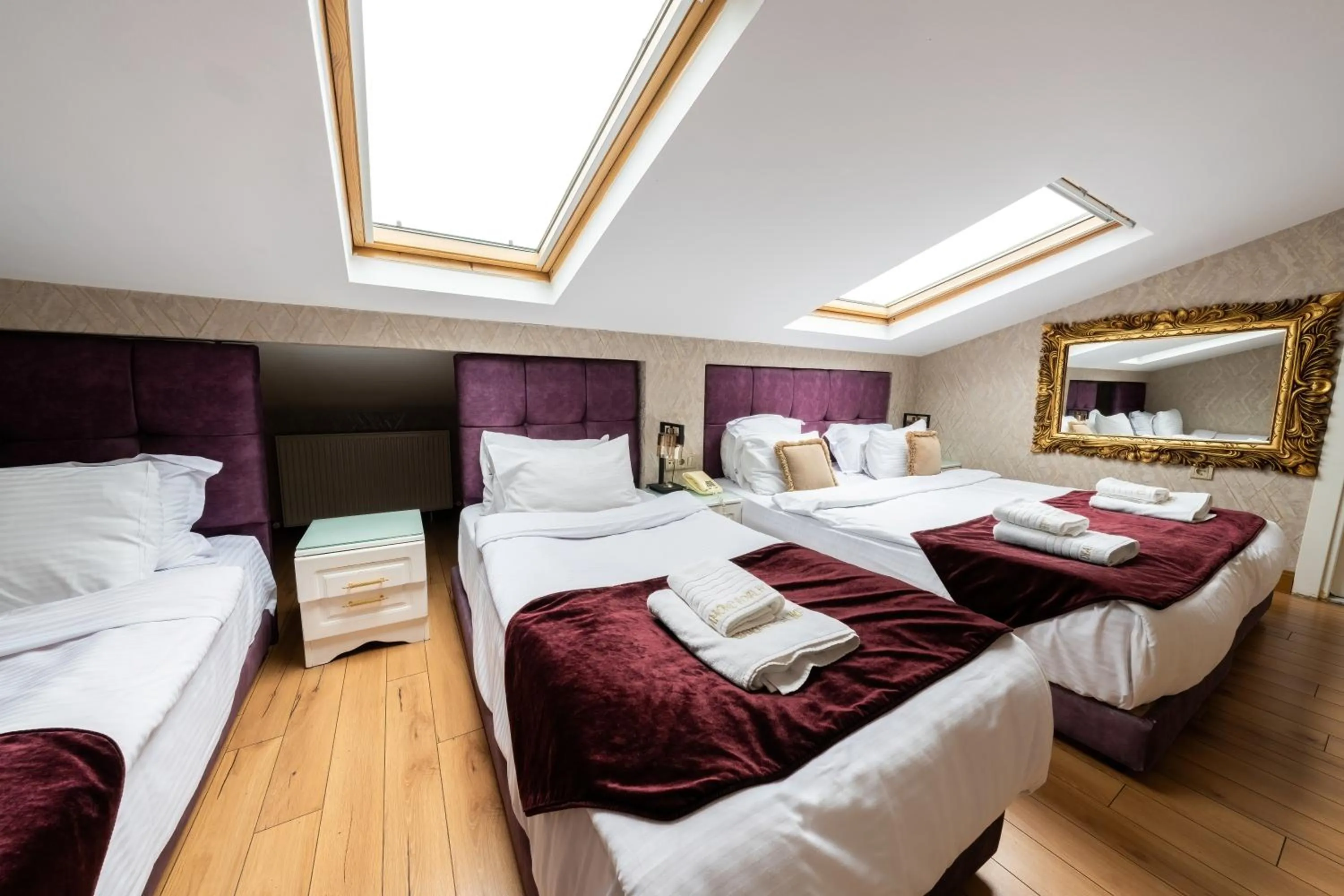 Bed in Diamond Royal Hotel