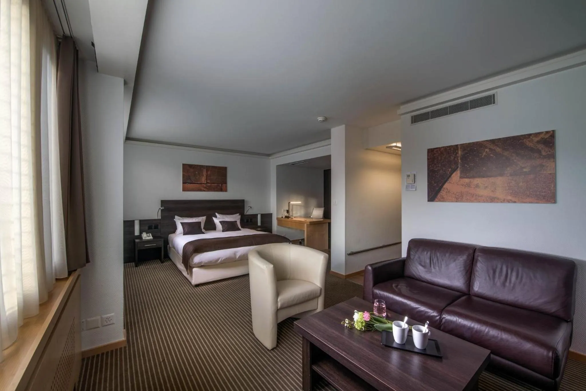 Photo of the whole room, Bed in Crowne Plaza Zürich by IHG
