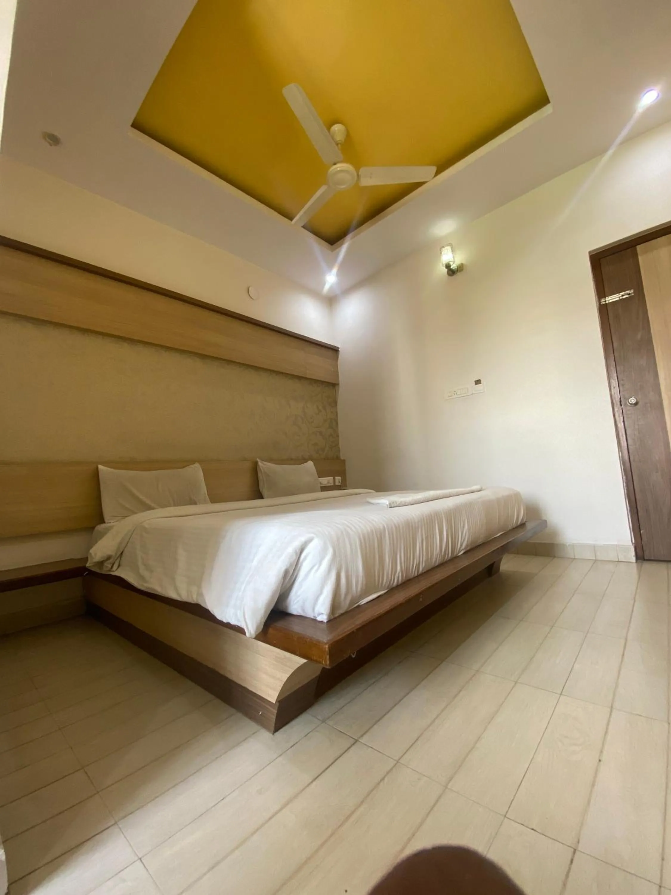 Photo of the whole room, Bed in HOTEL SRI VAARI RESIDENCY