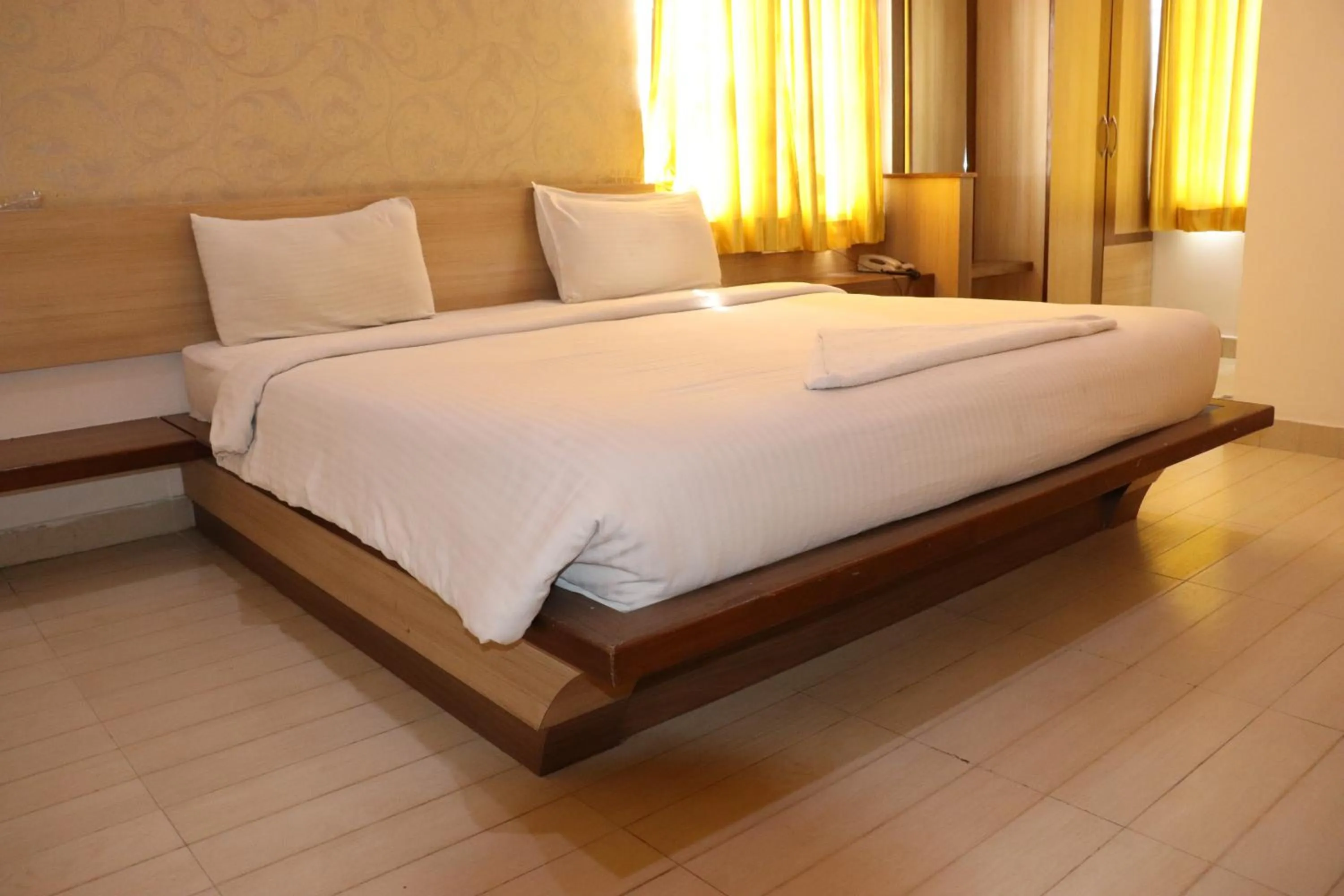 Bed in HOTEL SRI VAARI RESIDENCY