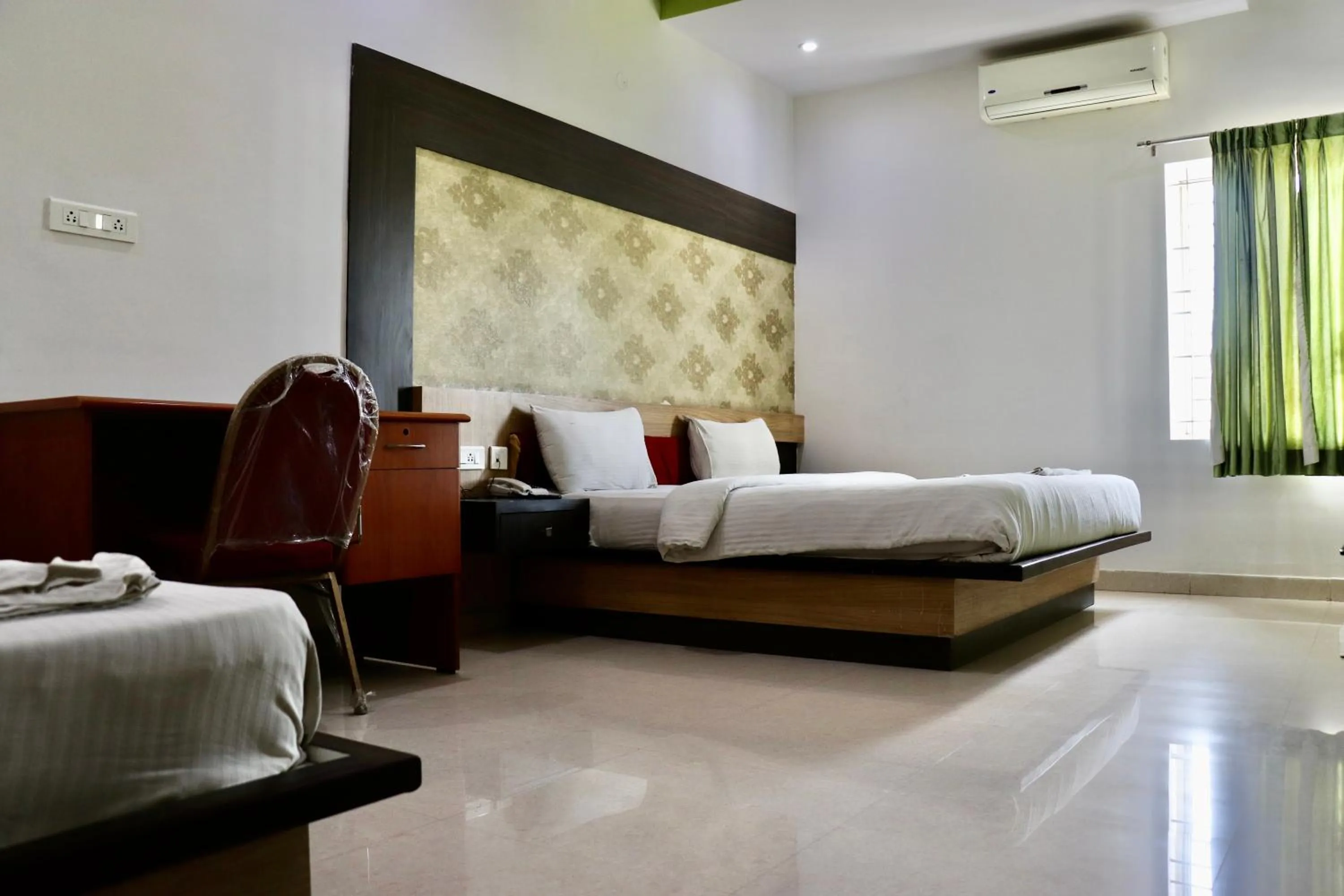 Photo of the whole room, Bed in HOTEL SRI VAARI RESIDENCY