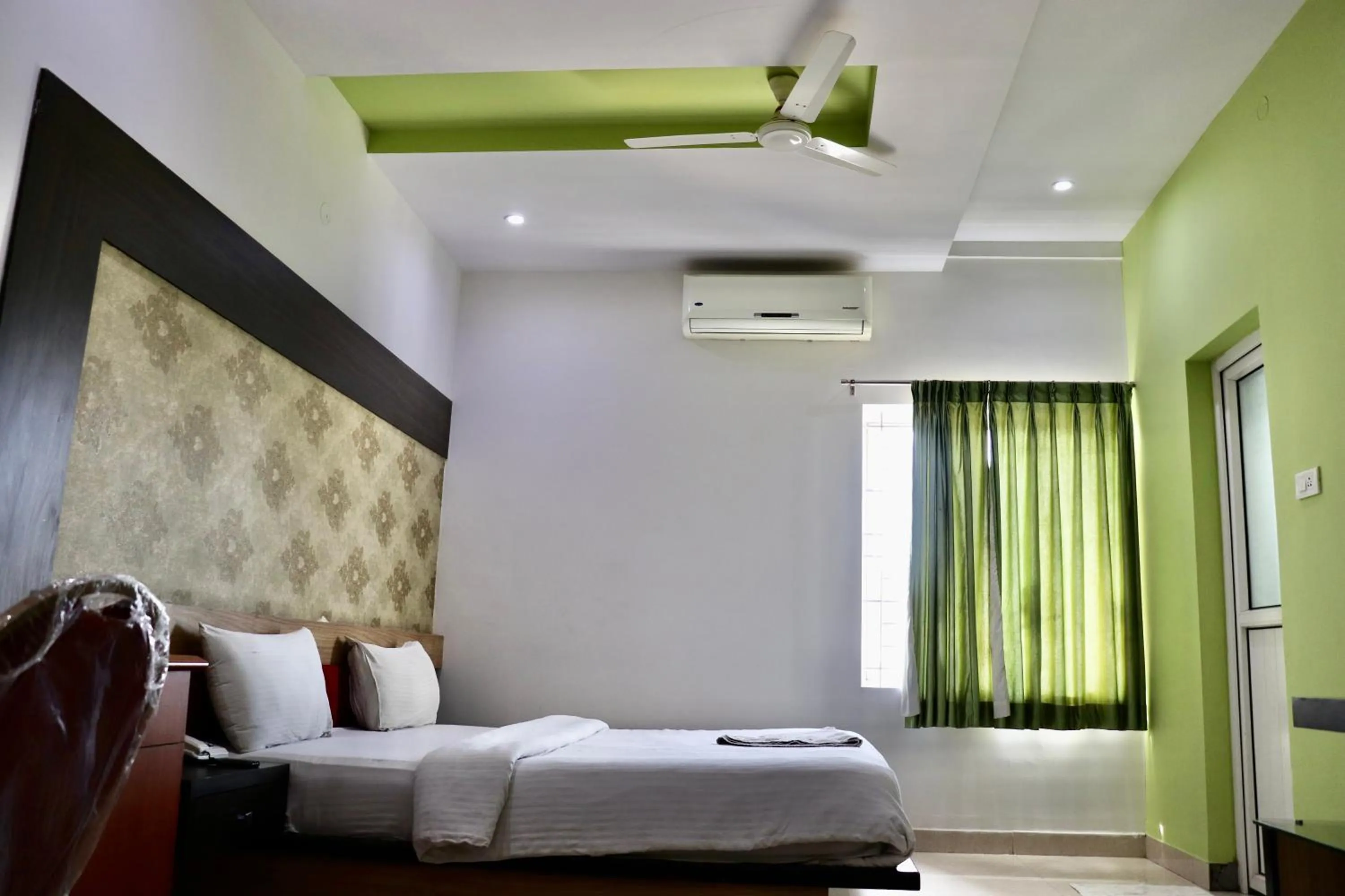 Photo of the whole room, Bed in HOTEL SRI VAARI RESIDENCY