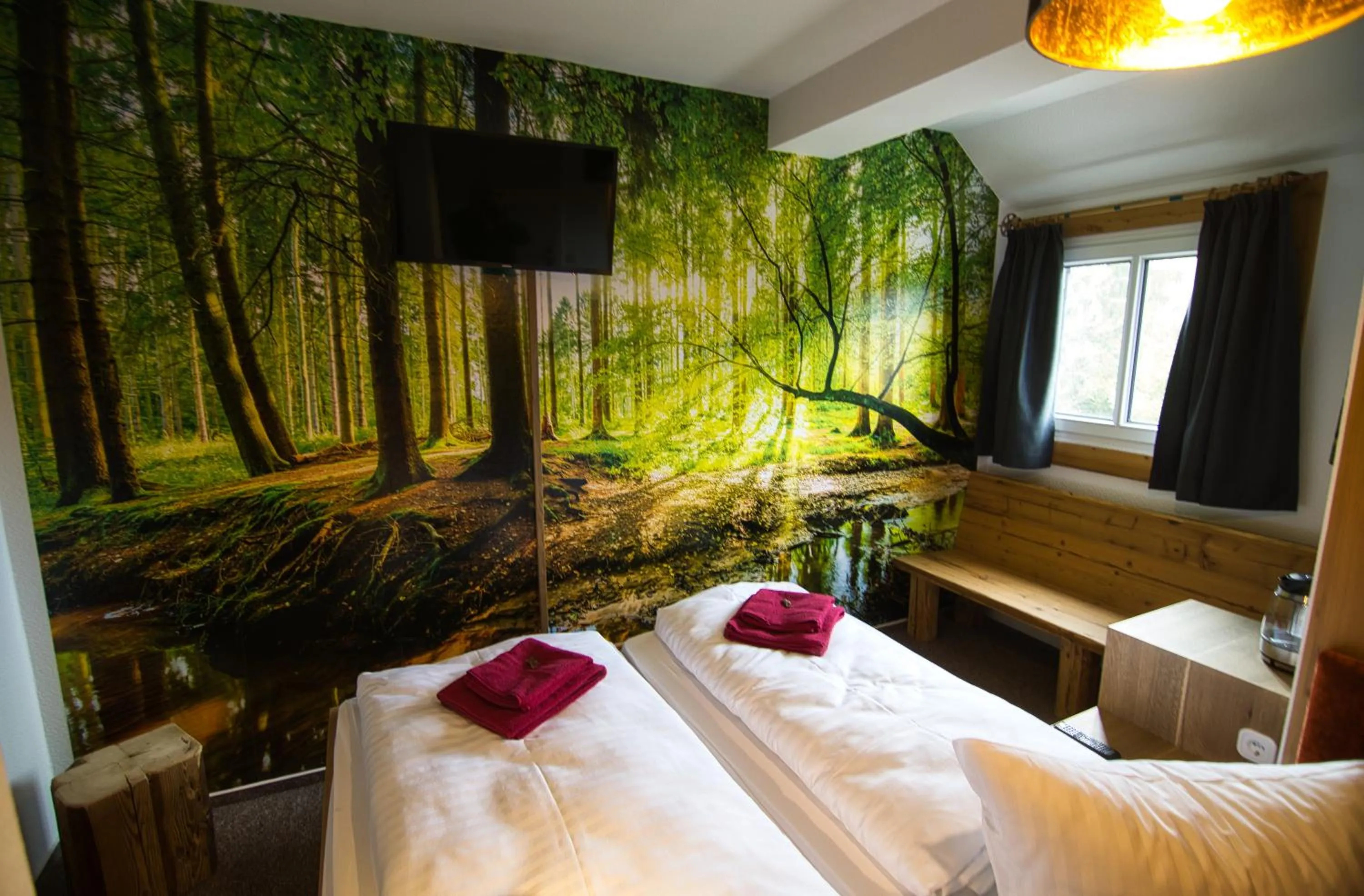 Seating area, Bed in Berghotel Bärenstein