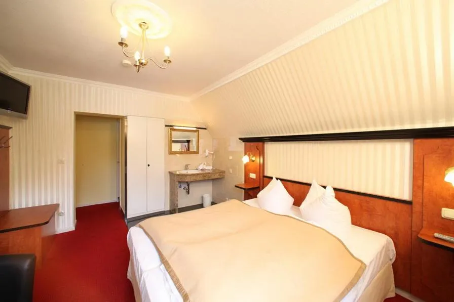 Bed in Gästehaus Plönlein - Hotel Goldener Hirsch Rothenburg