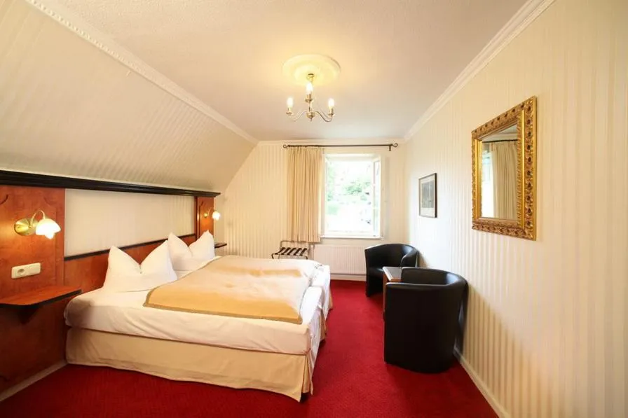 Bed in Gästehaus Plönlein - Hotel Goldener Hirsch Rothenburg