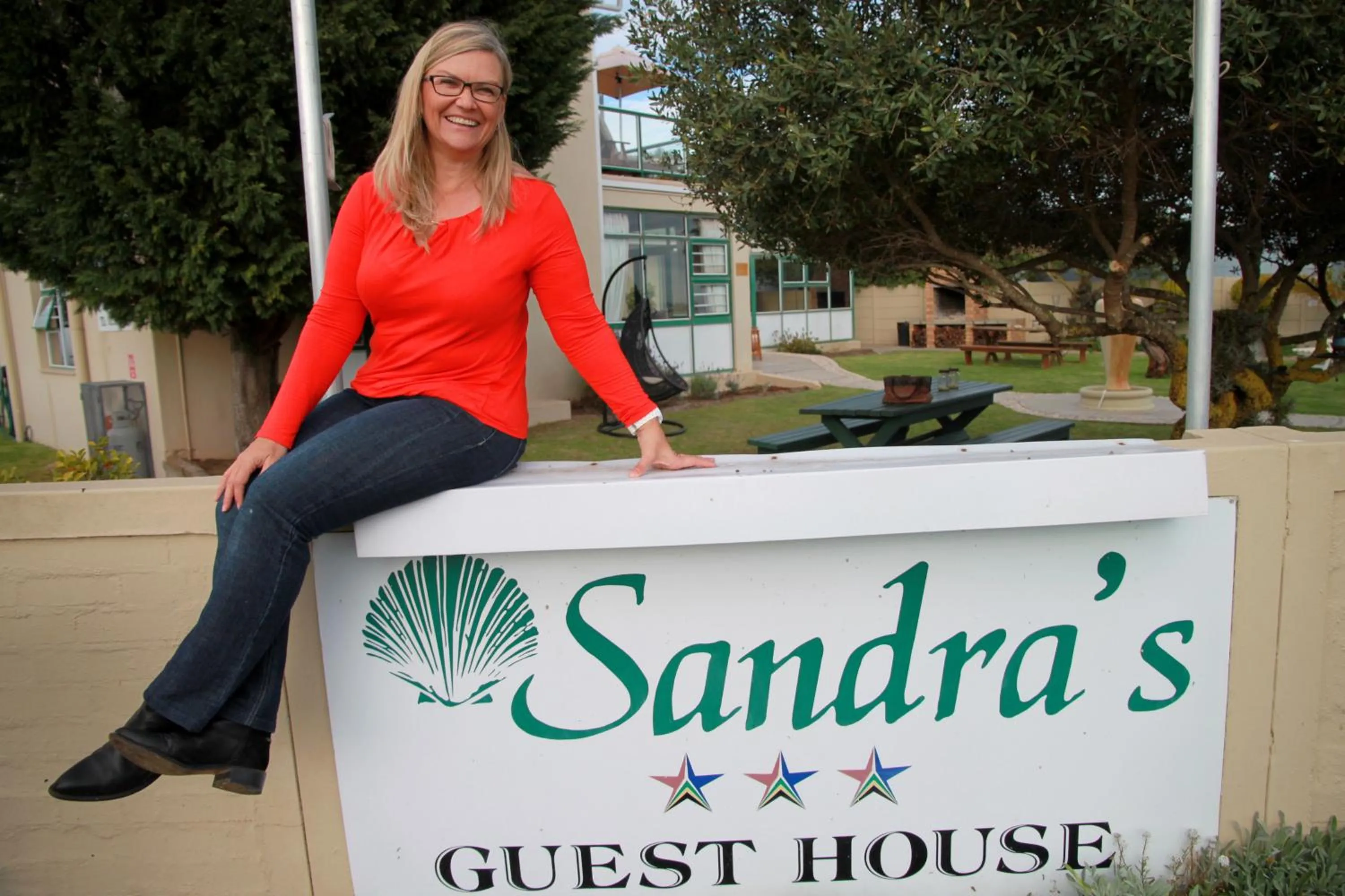 Property logo or sign in Sandra's Guest House