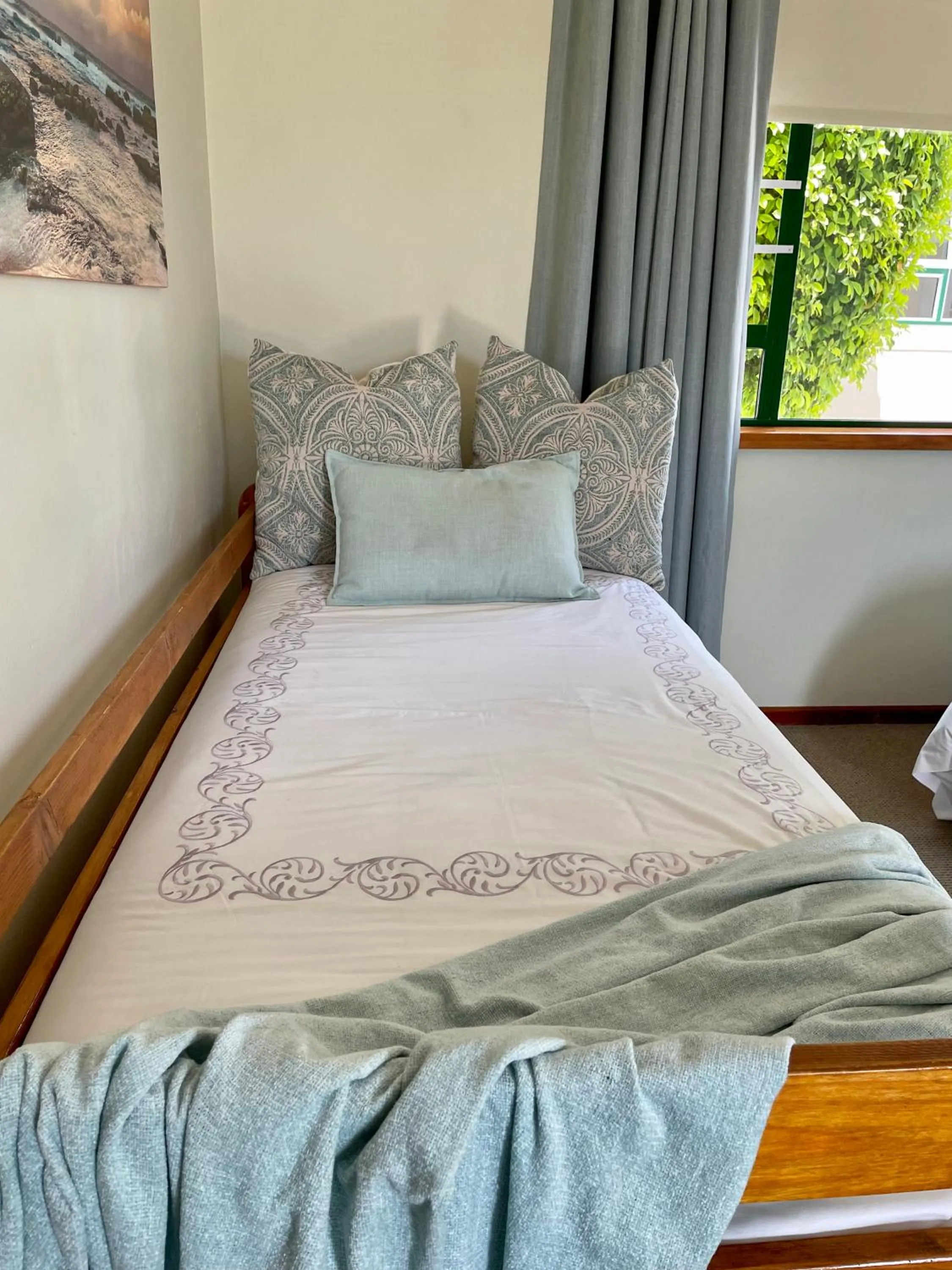 Bed in Sandra's Guest House