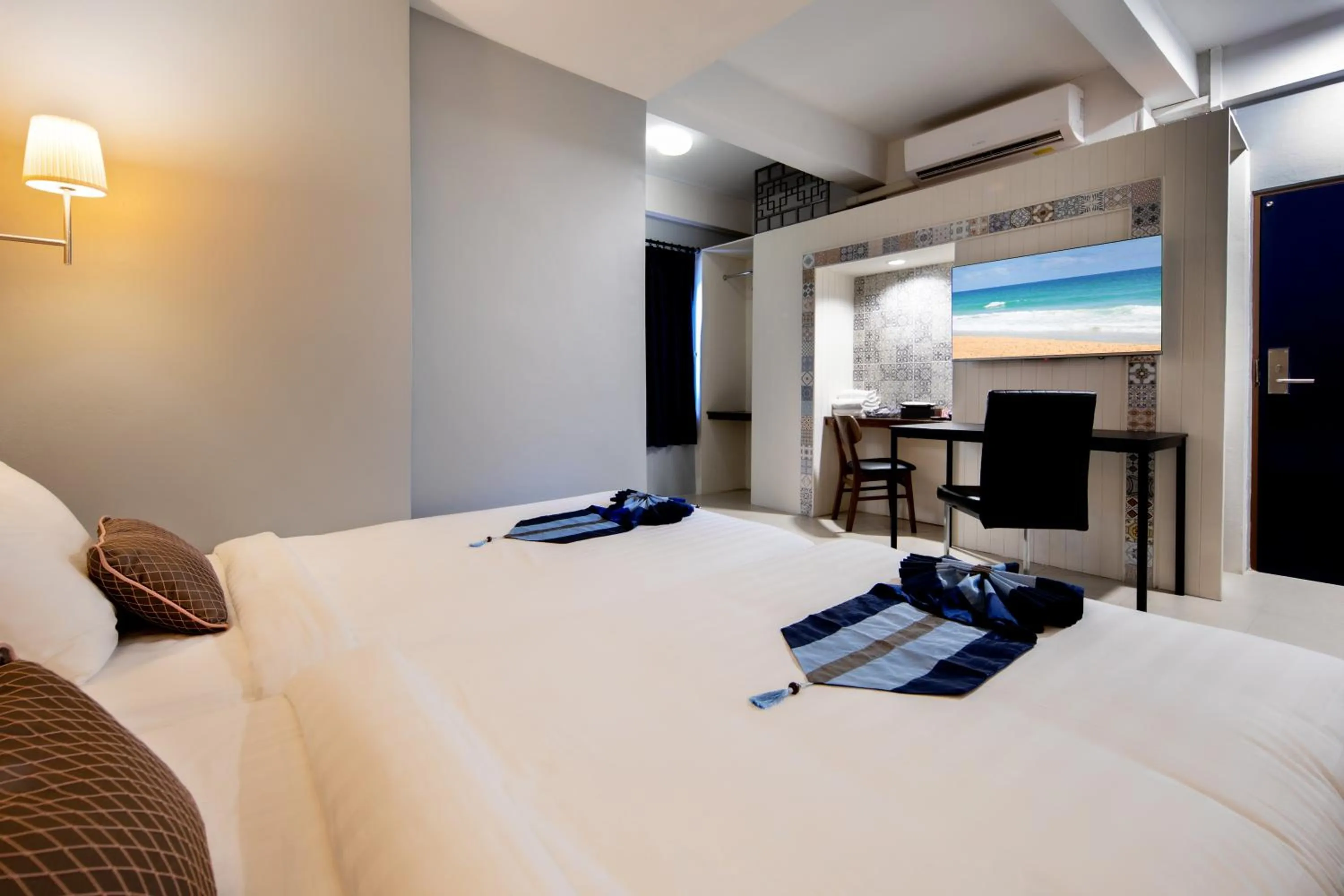 Bed in Montree Phuket Hotel