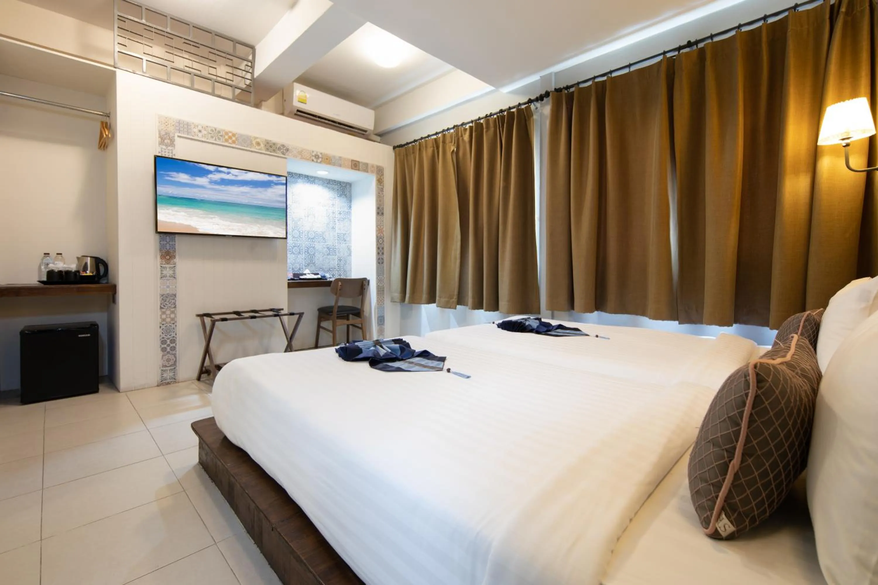 Bed in Montree Phuket Hotel