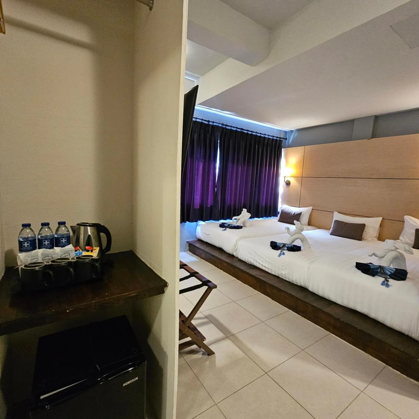 Bed in Montree Phuket Hotel