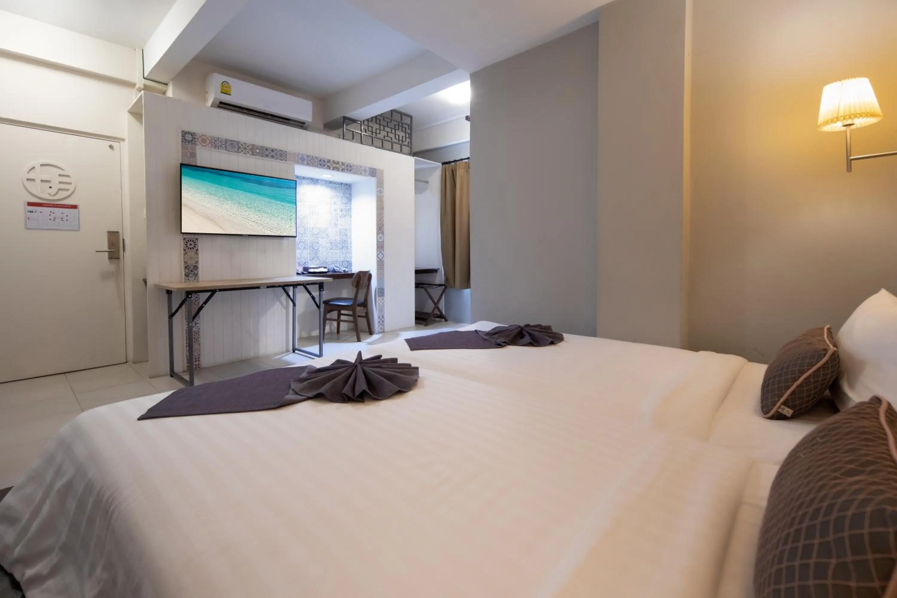 Bed in Montree Phuket Hotel