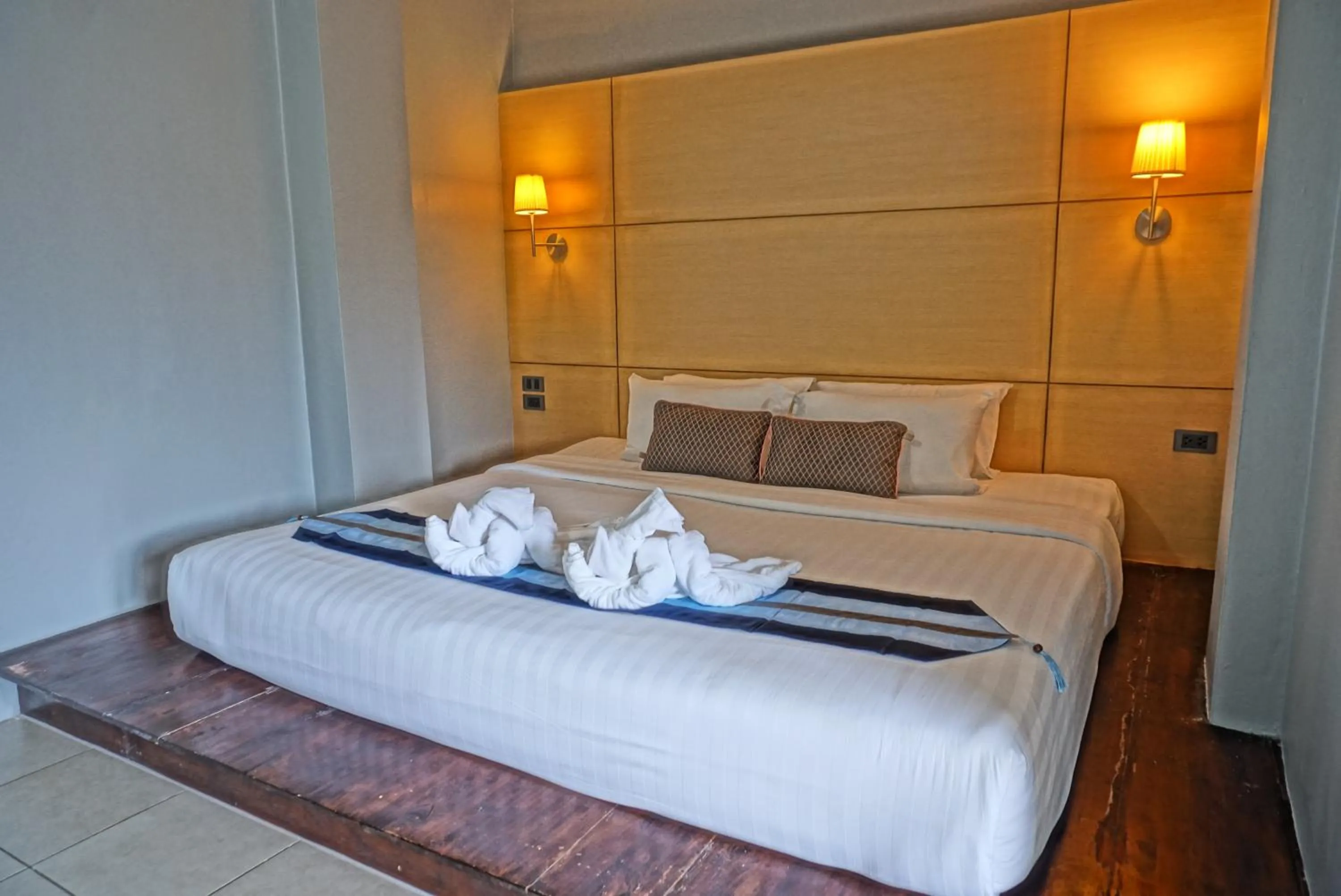 Bed in Montree Phuket Hotel