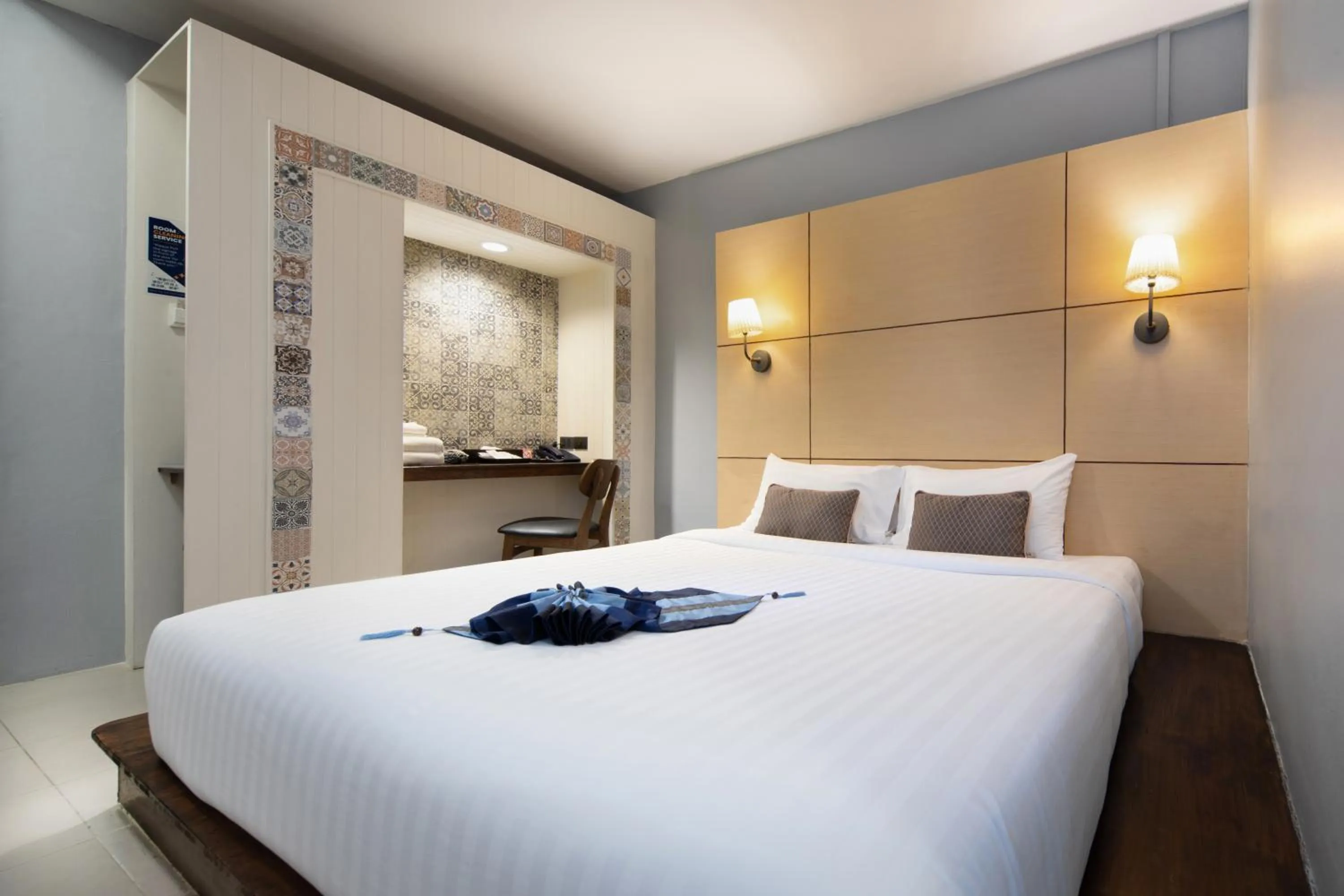 Bed in Montree Phuket Hotel