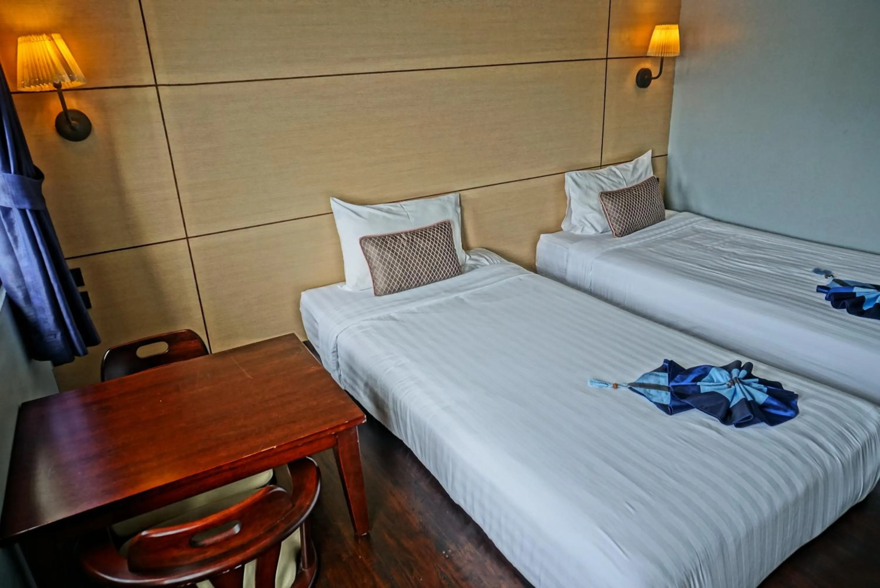 Bed in Montree Phuket Hotel