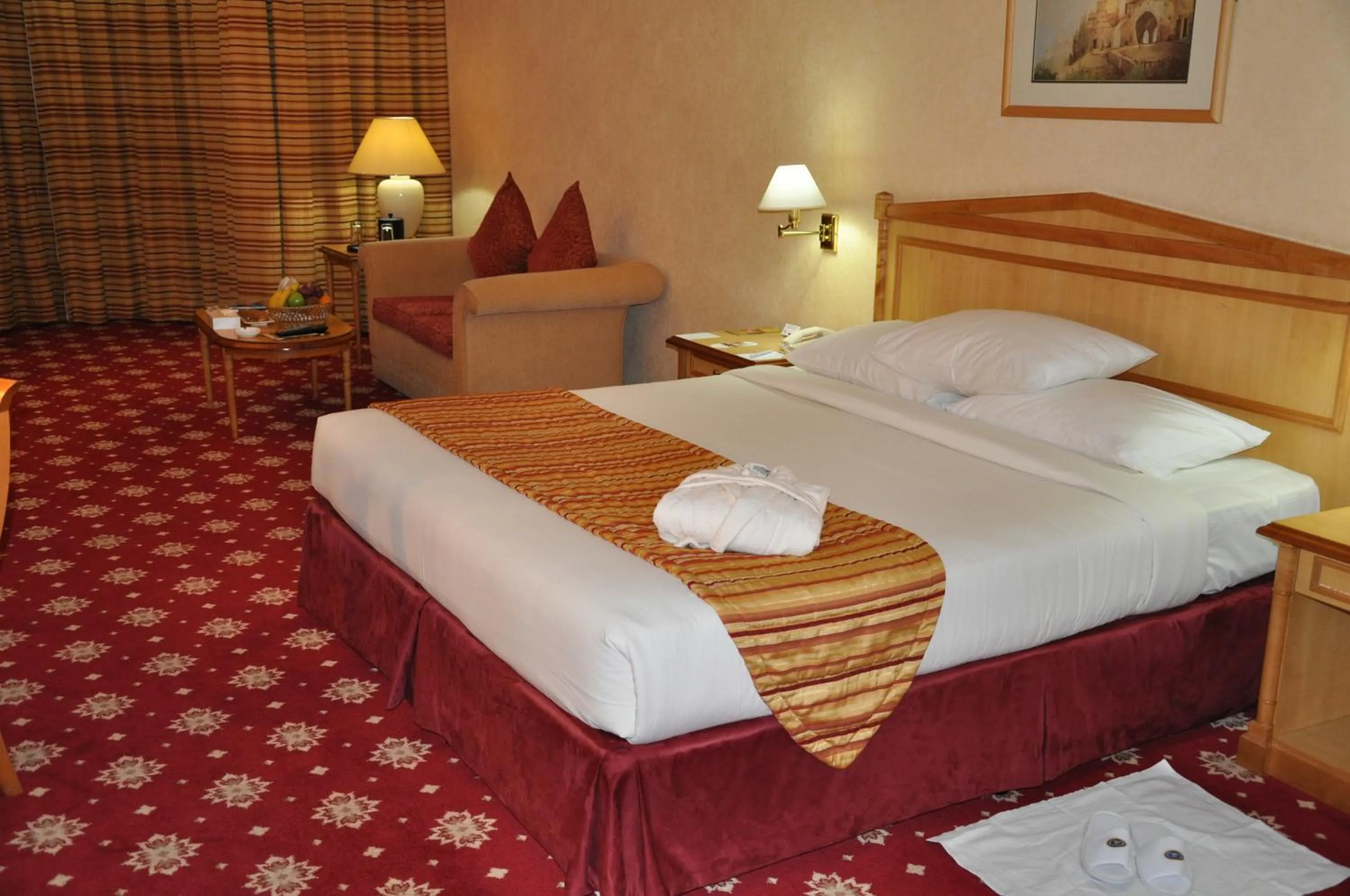Photo of the whole room, Bed in Grand Continental Hotel