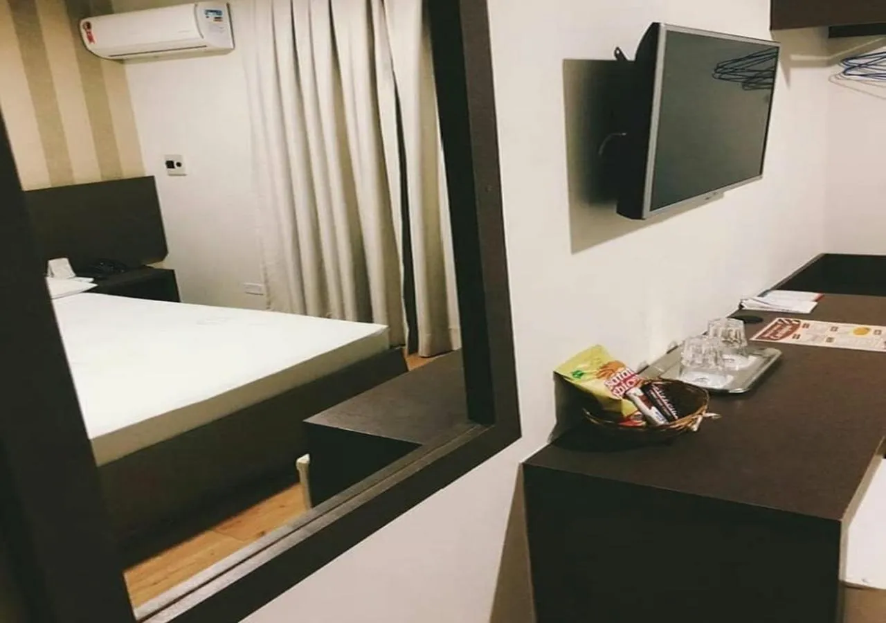 Bed in David Plaza Hotel