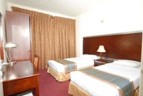 Bed in Royal Plaza Hotel Apartments