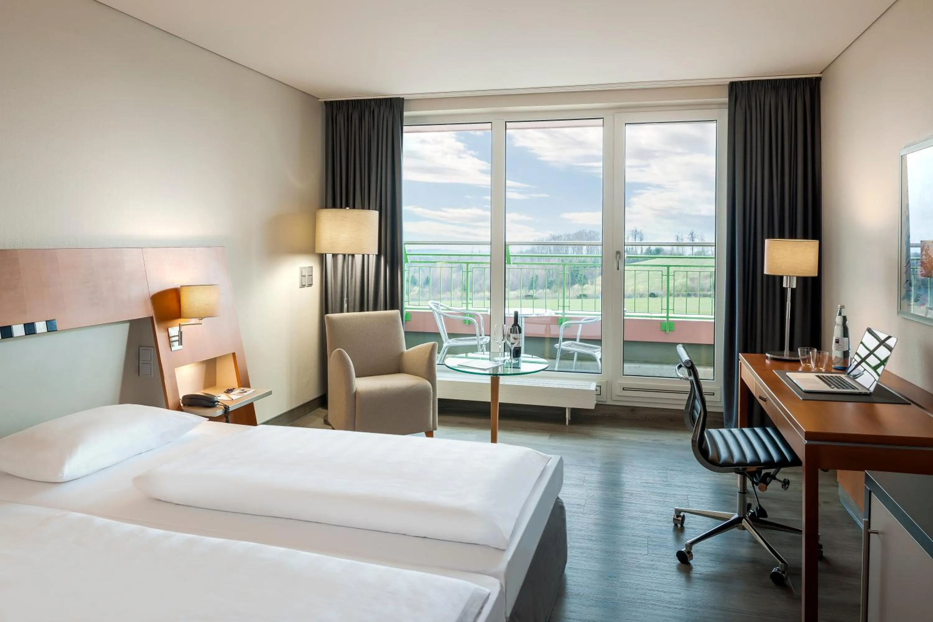 Photo of the whole room, Bed in Dorint Am Nürburgring Hocheifel