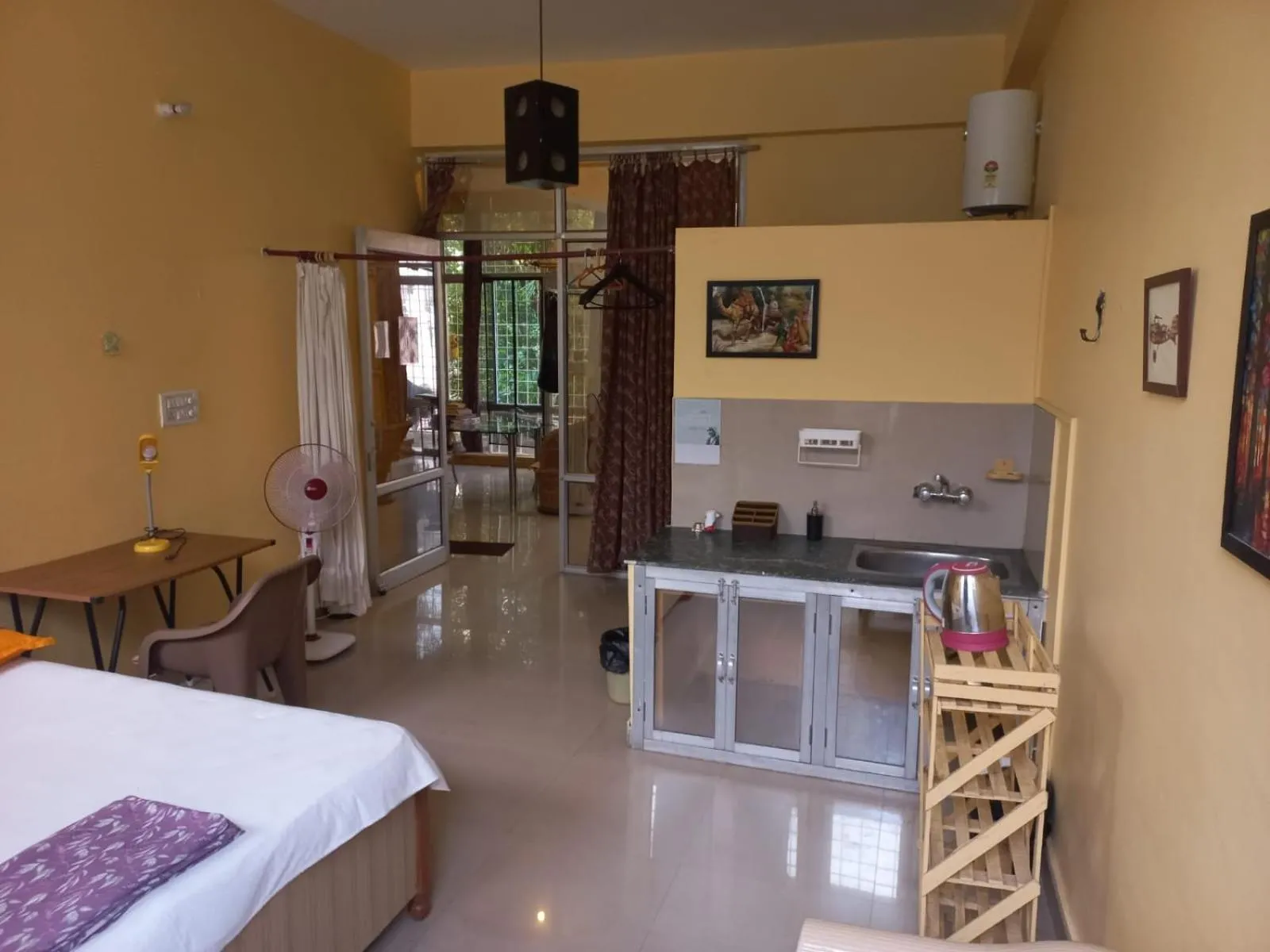 Photo of the whole room, Bed in Devi music ashram