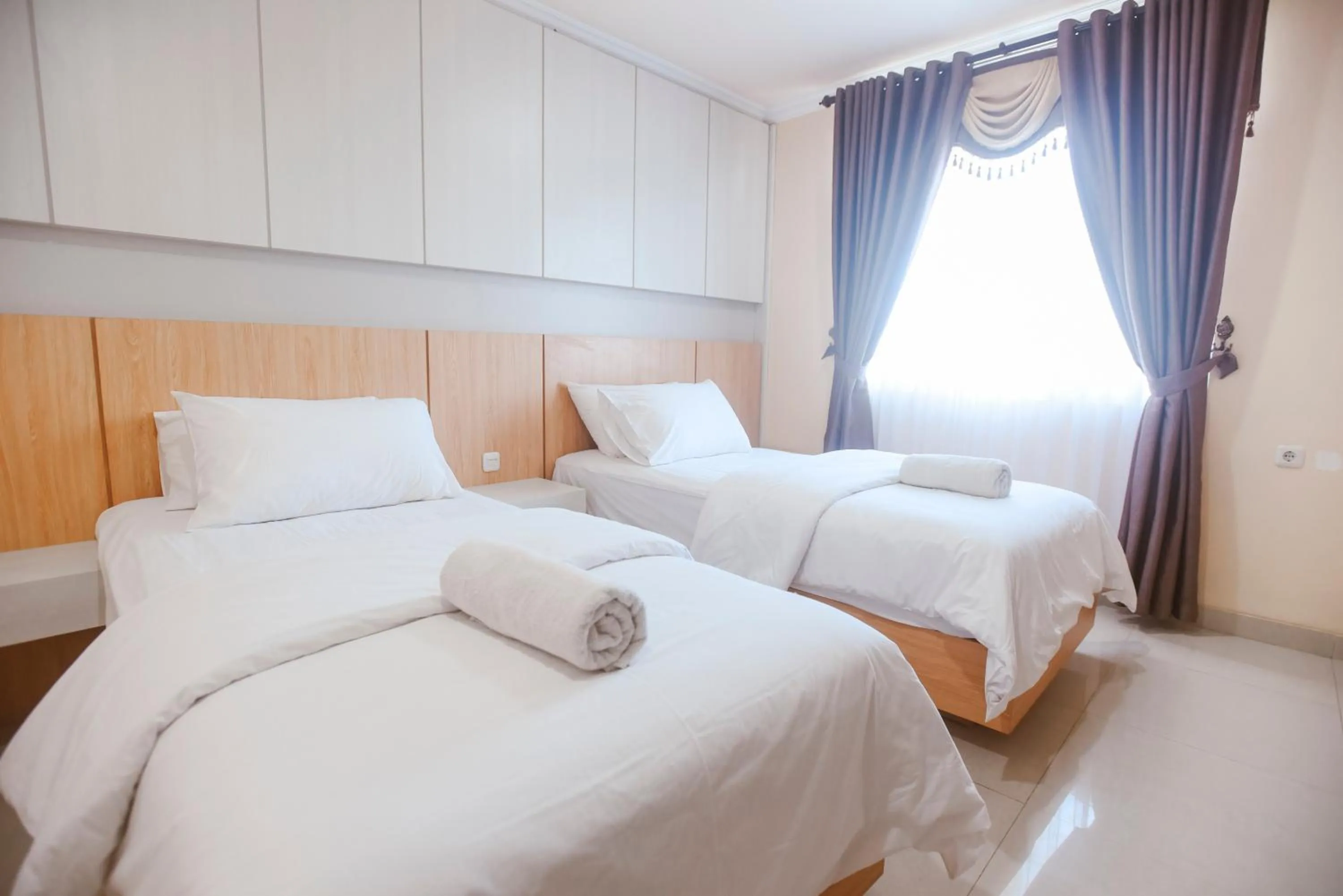 Bed in CHRYSANT HOTEL & RESORT