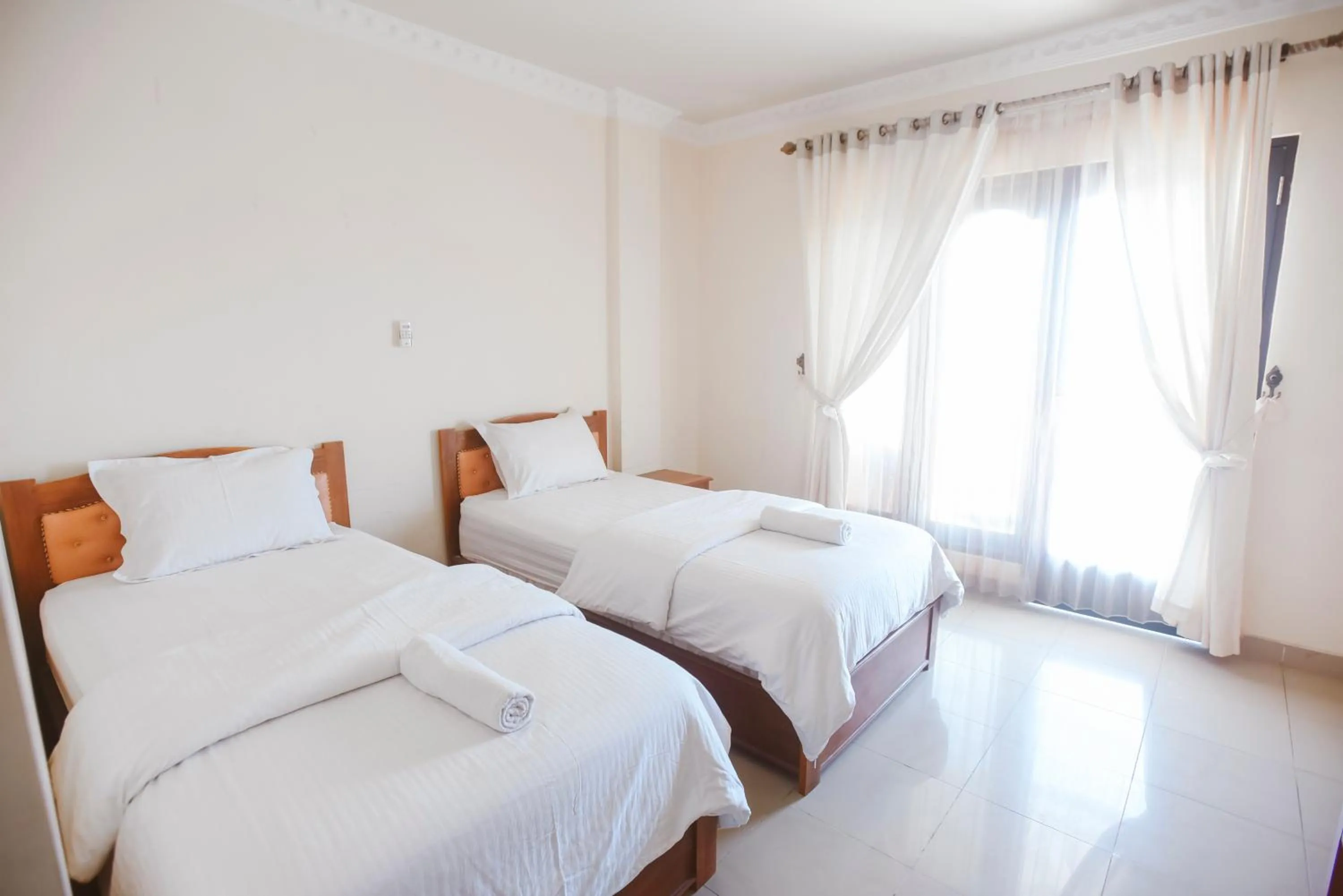 Bed in CHRYSANT HOTEL & RESORT