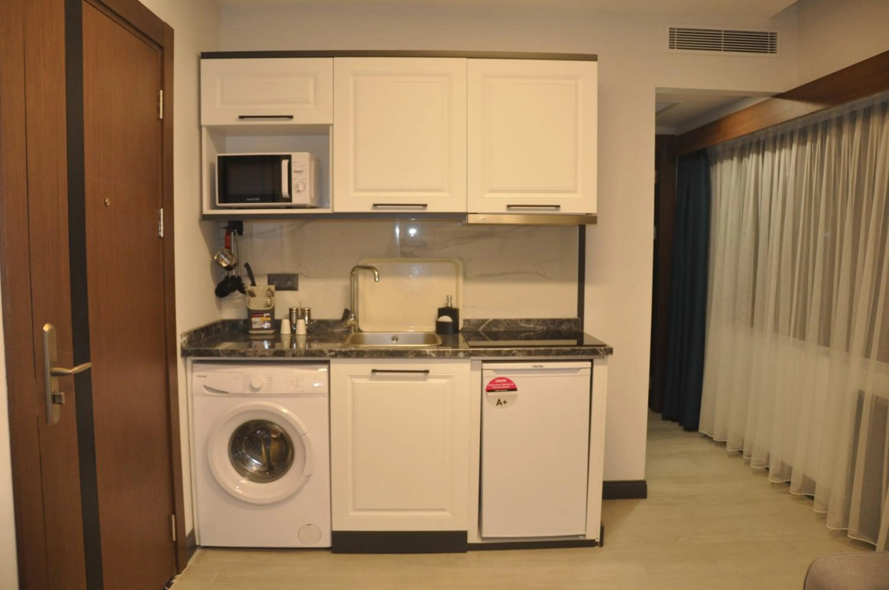 Kitchen or kitchenette in GOLAZ SUİT OTEL