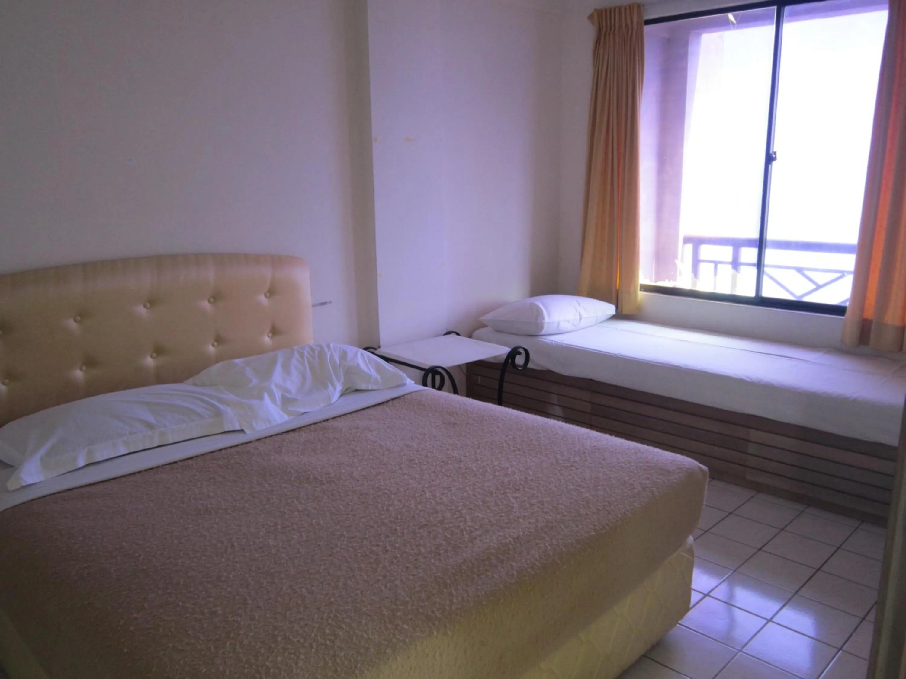 Bed in Paradise Lagoon Apartment