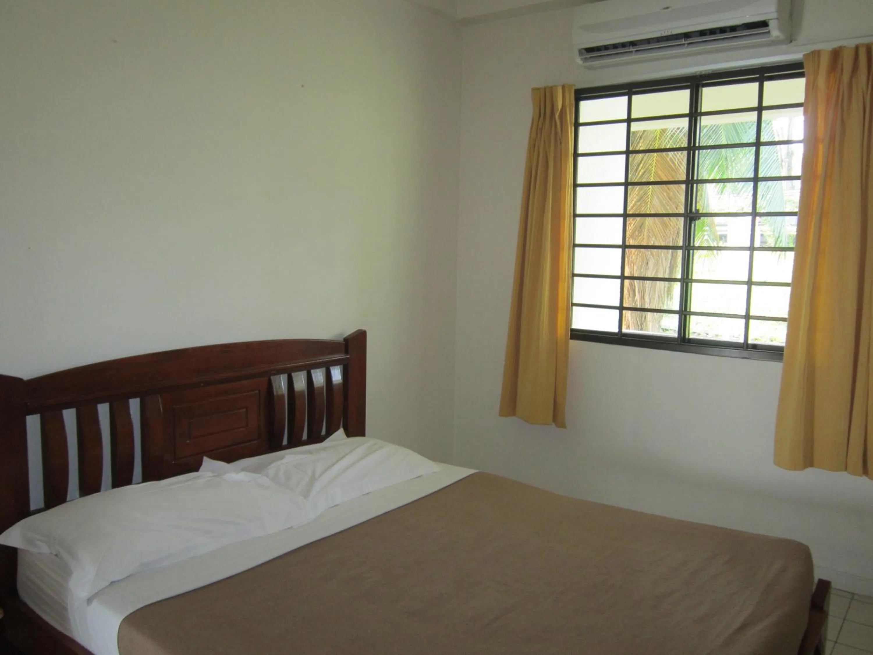 Bed in Paradise Lagoon Apartment