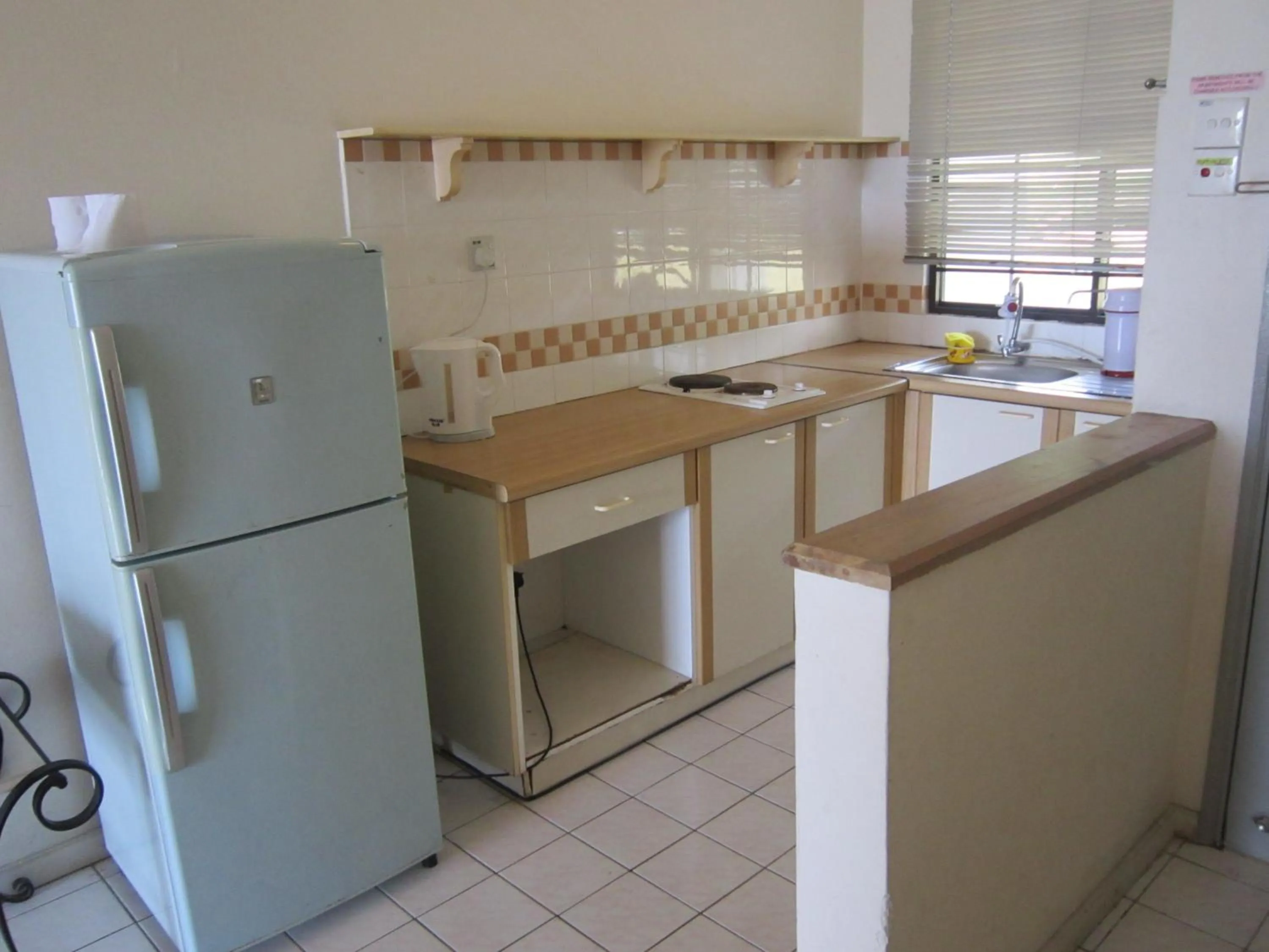 Kitchen or kitchenette in Paradise Lagoon Apartment