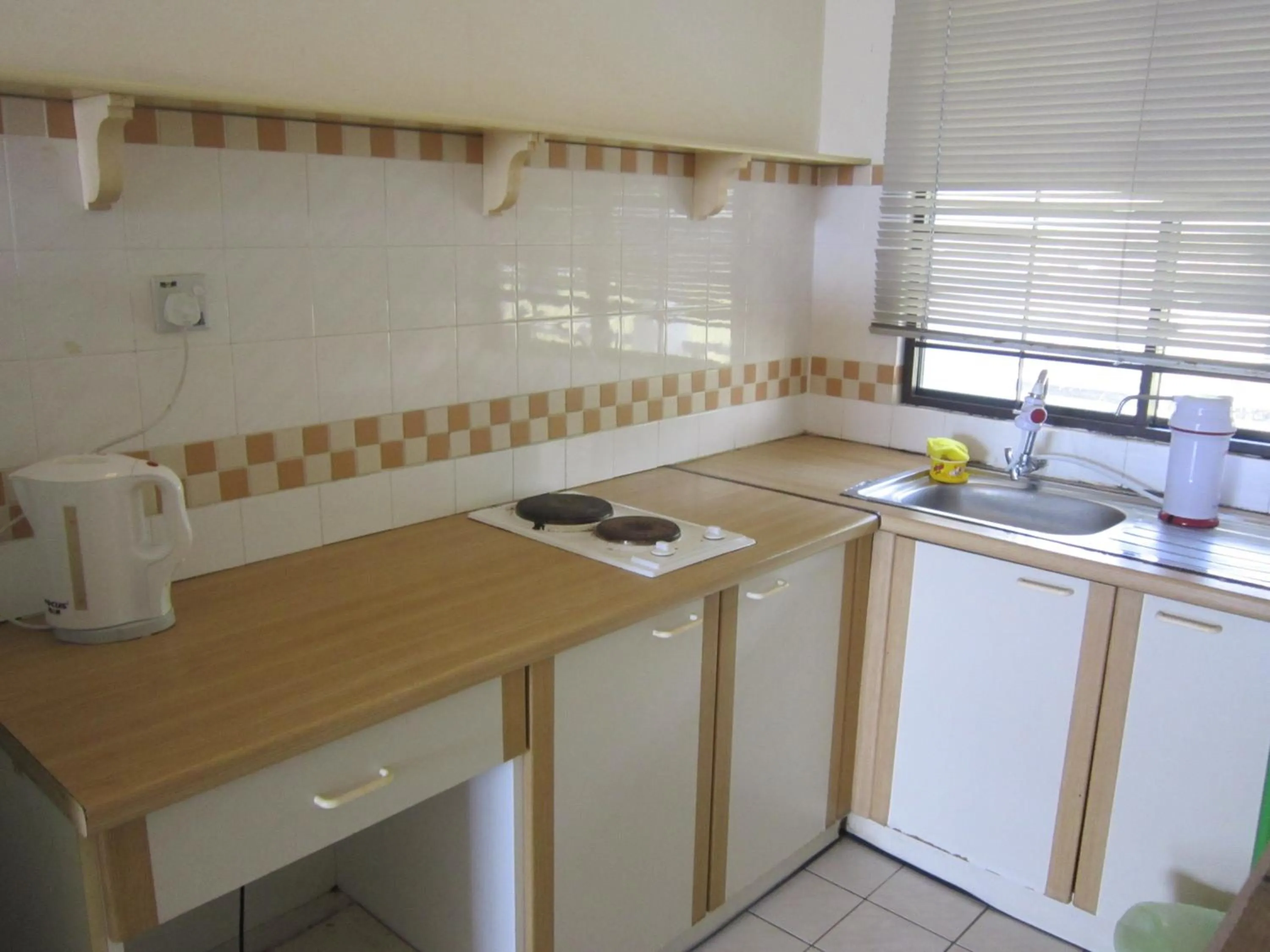 Kitchen or kitchenette in Paradise Lagoon Apartment