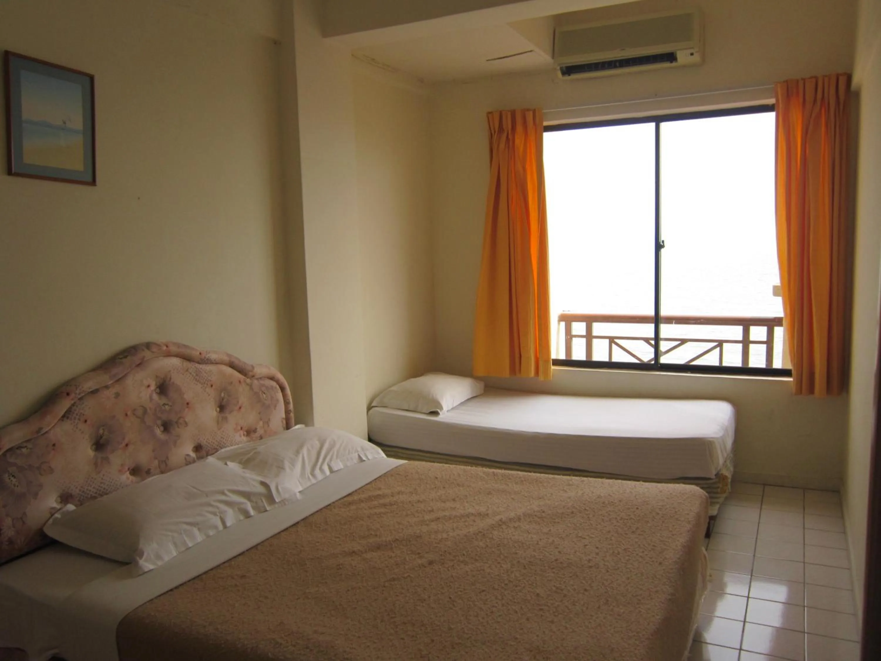 Bed in Paradise Lagoon Apartment