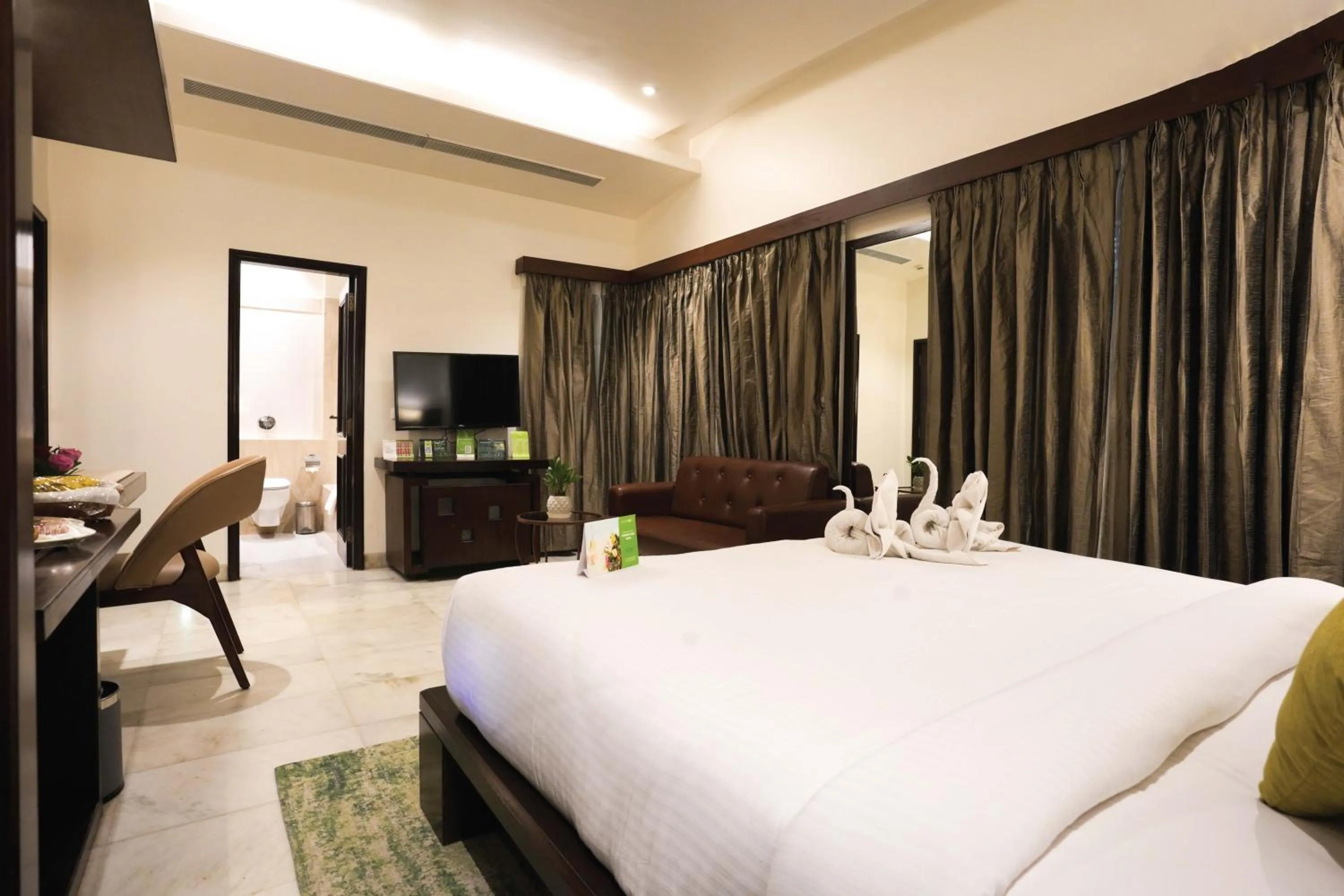 Bedroom, Bed in Leisure Inn Grand Chanakya