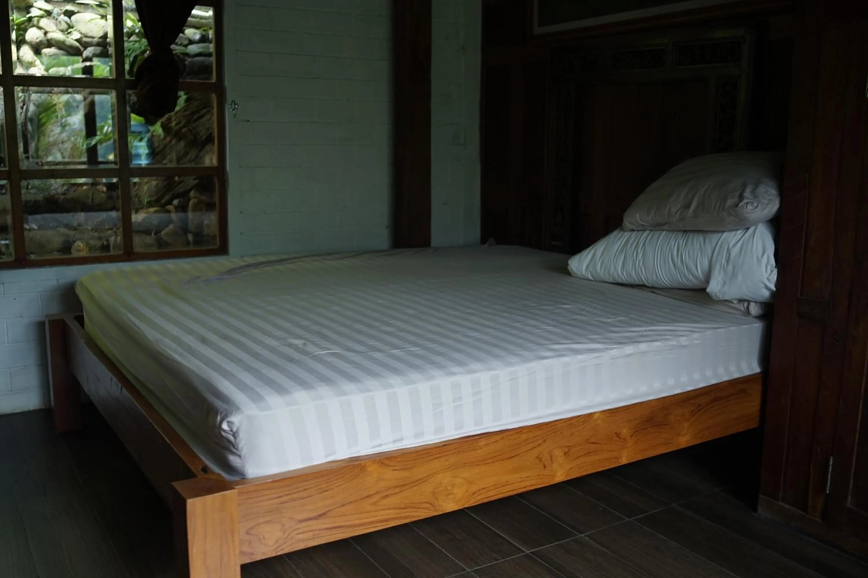 Bed in Tirta Arsanta Hot Springs & Villa