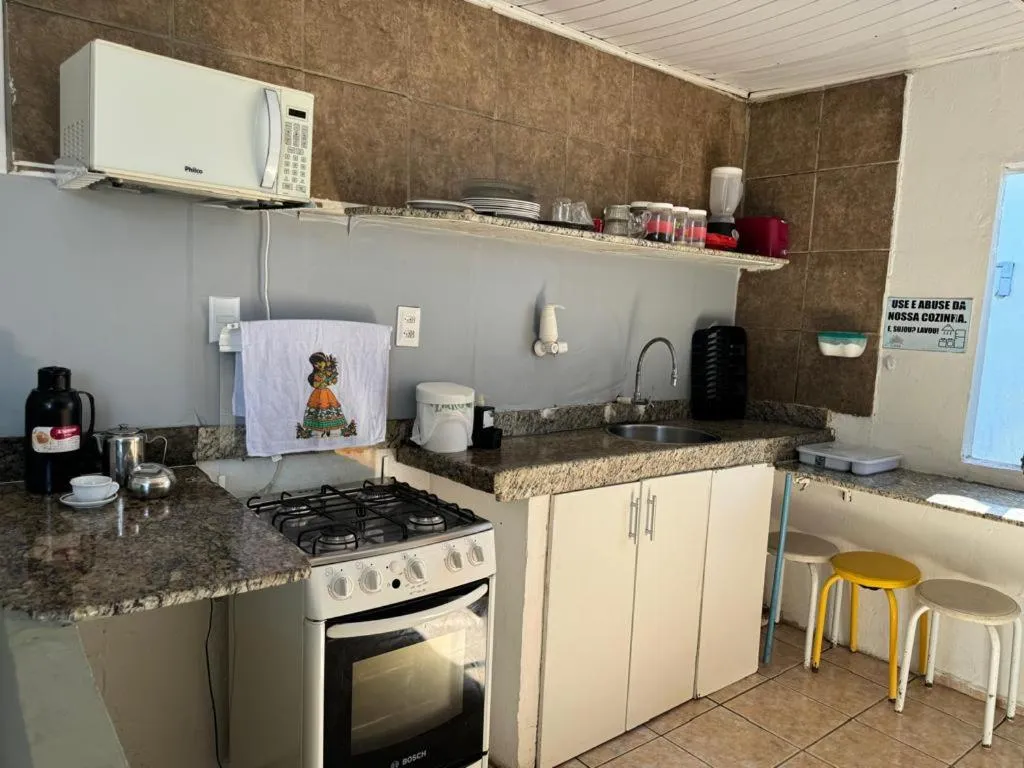 Kitchen or kitchenette in Casa Aeroporto Pousada
