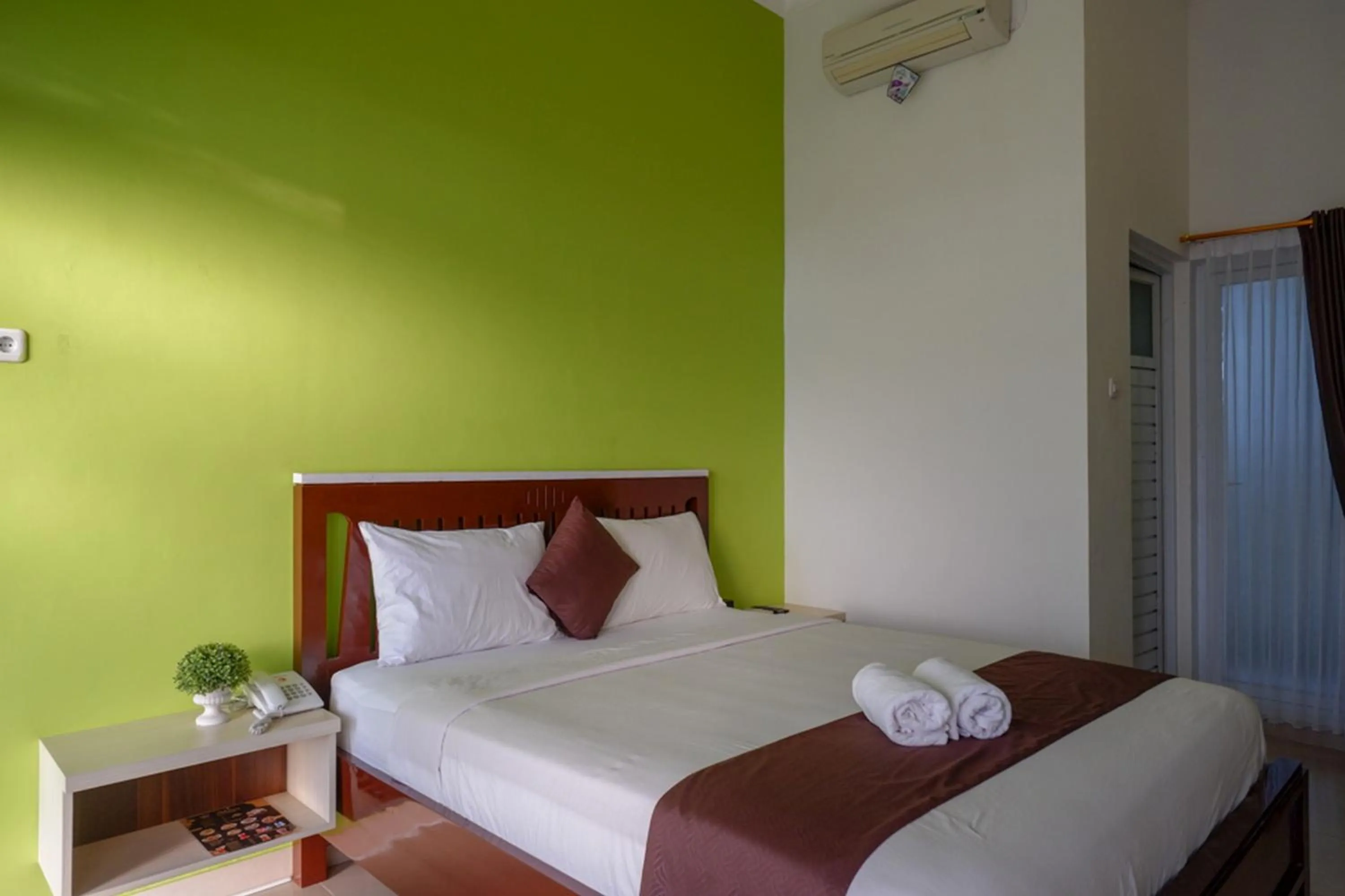 Bed in RedDoorz Syariah at Omah Sawah