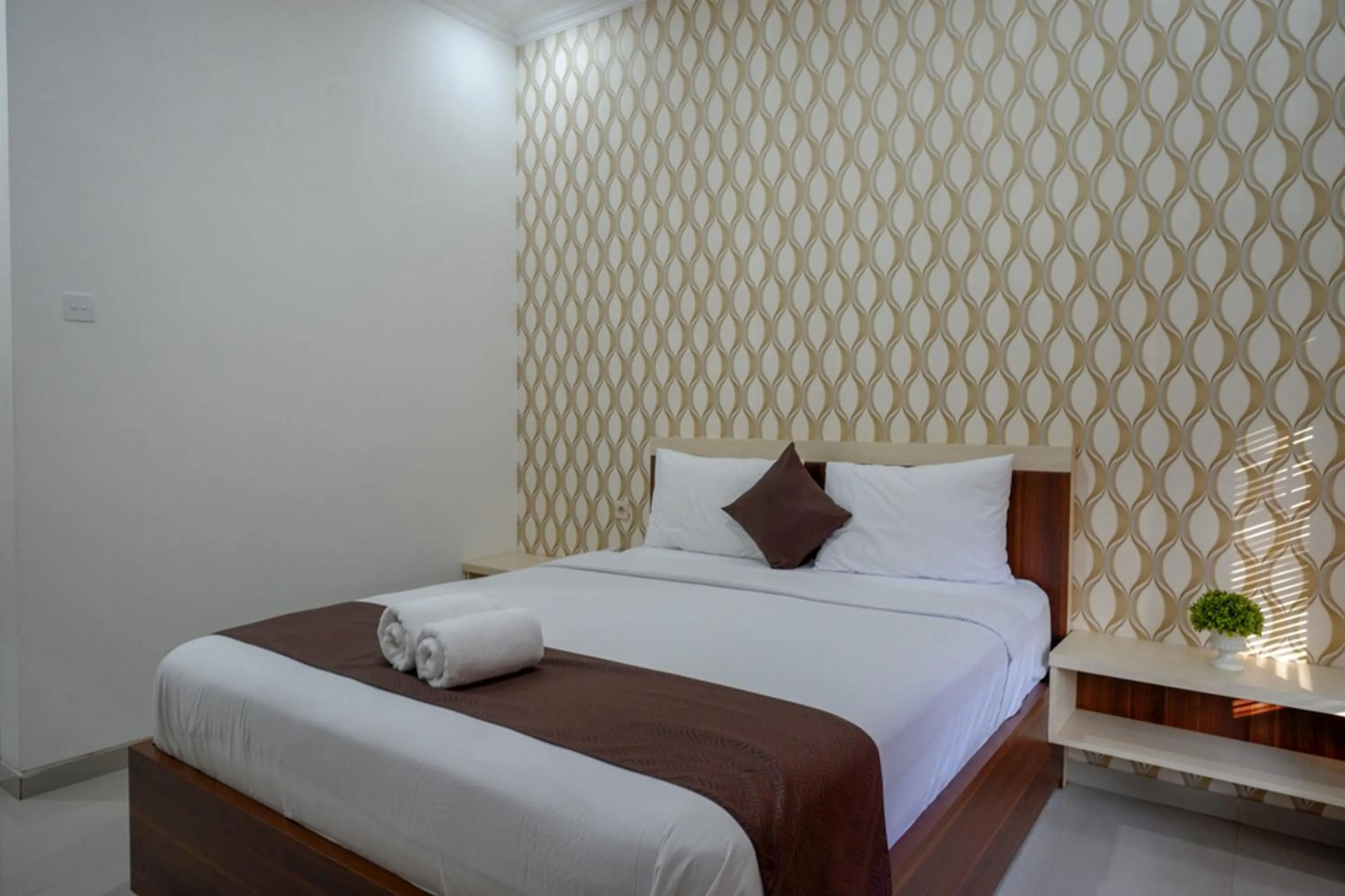 Bed in RedDoorz Syariah at Omah Sawah