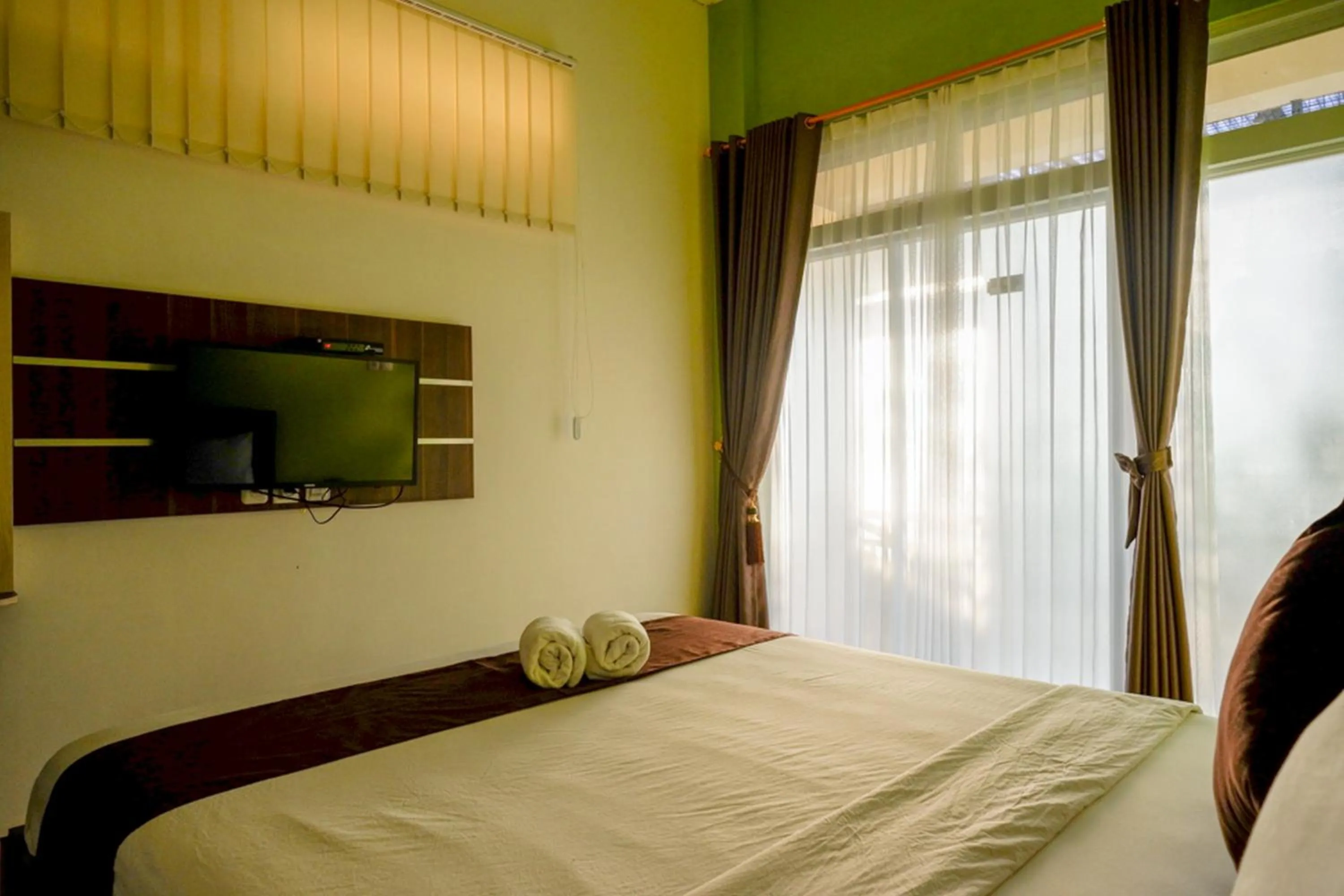 Bed in RedDoorz Syariah at Omah Sawah