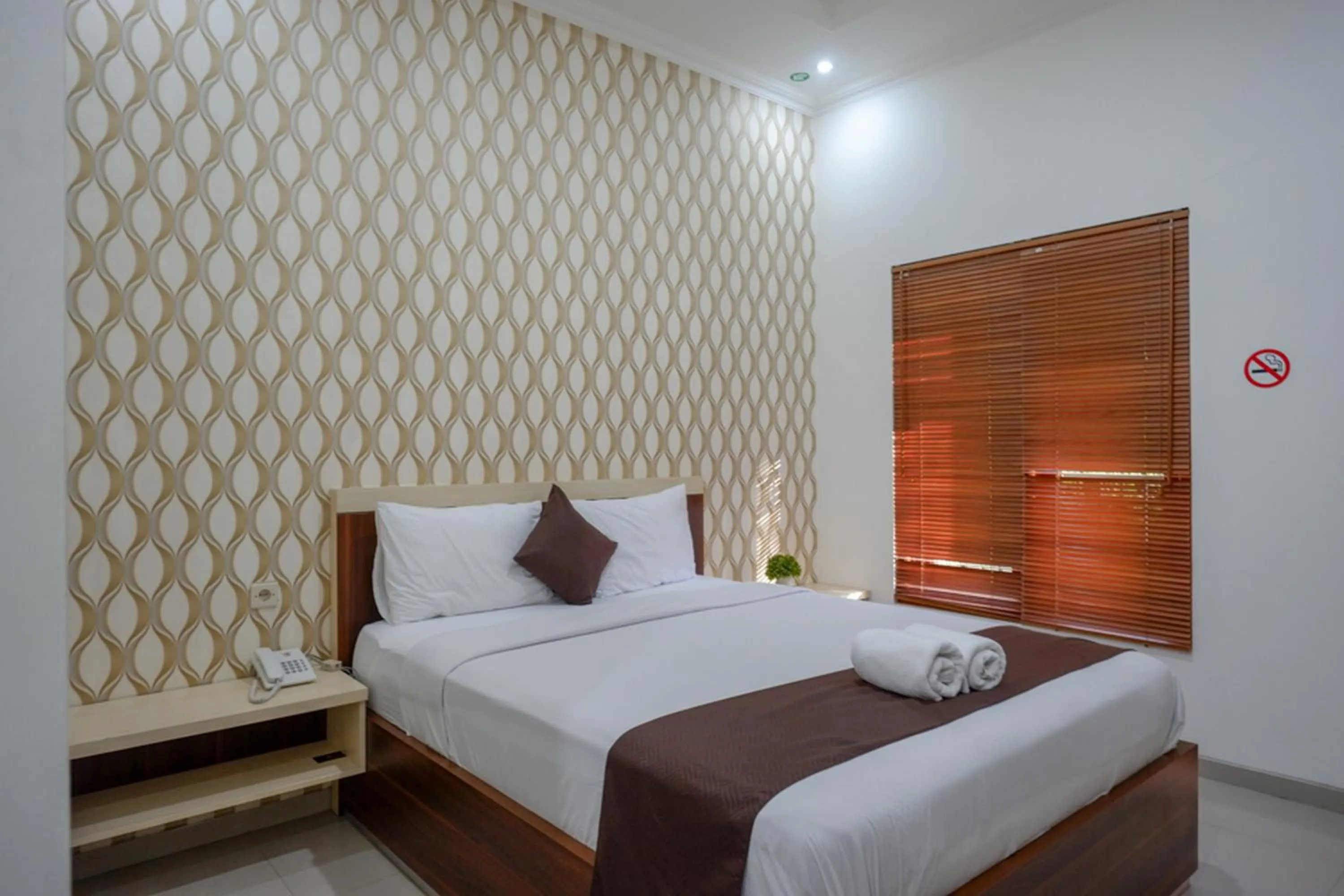 Bed in RedDoorz Syariah at Omah Sawah