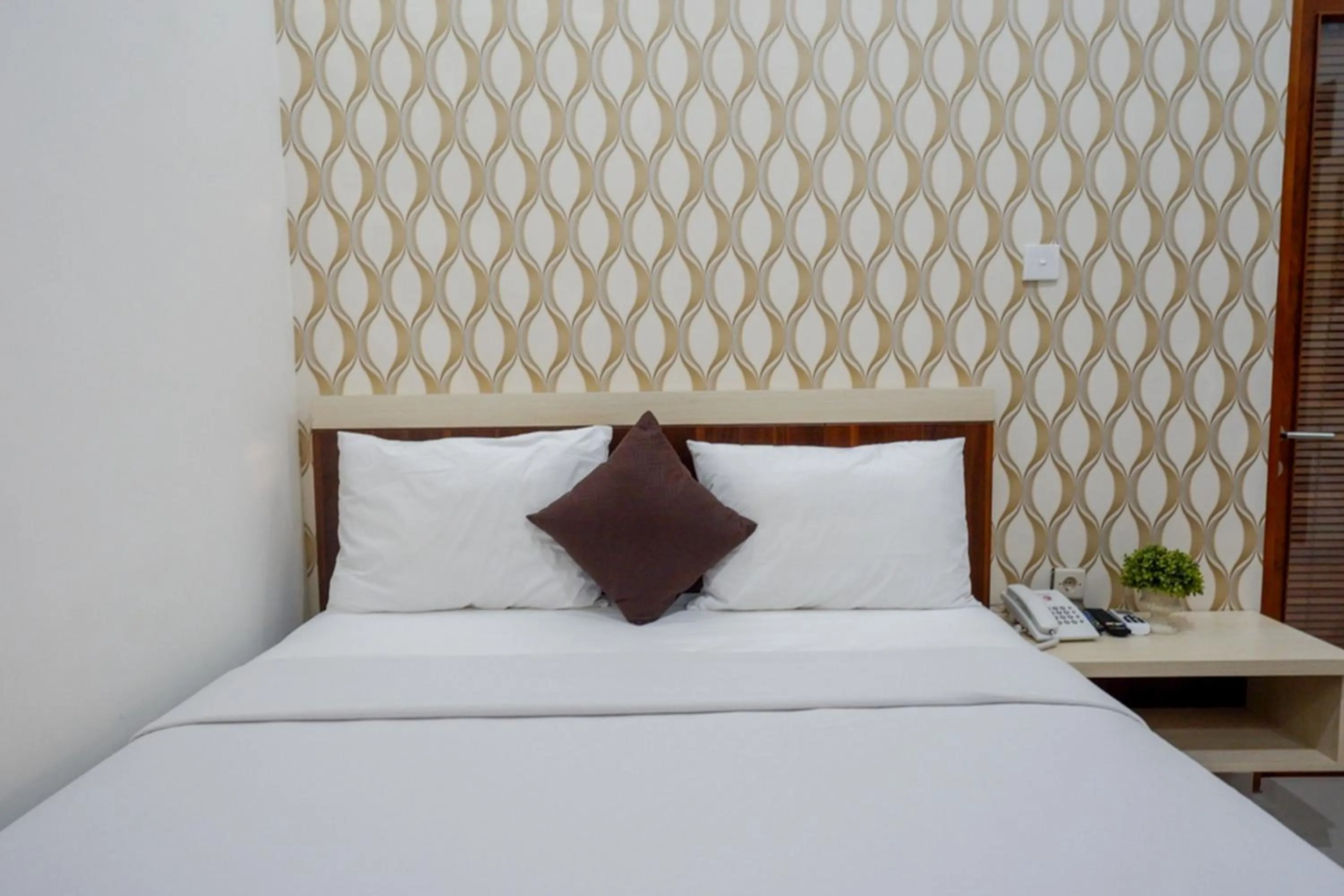 Bed in RedDoorz Syariah at Omah Sawah