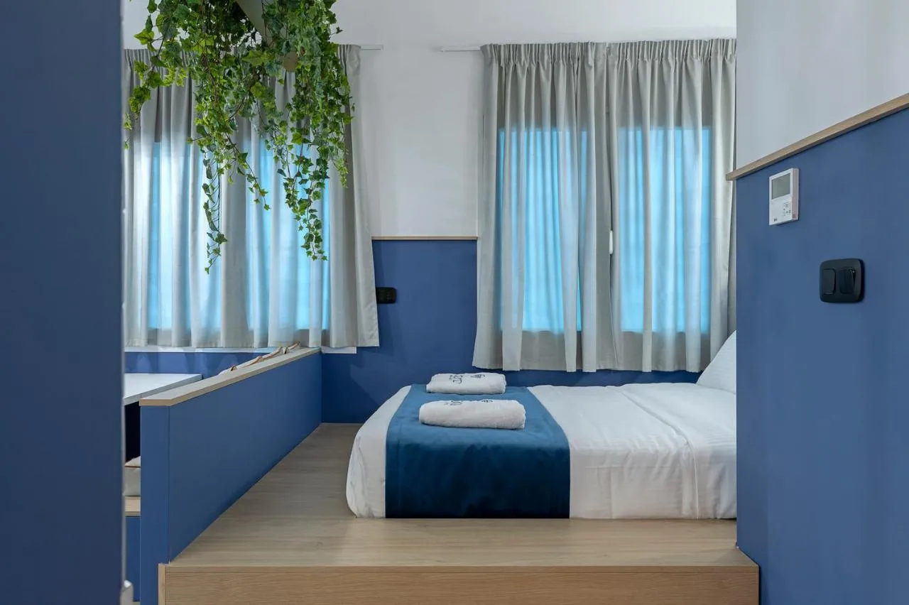 Bed in Acro Urban Suites