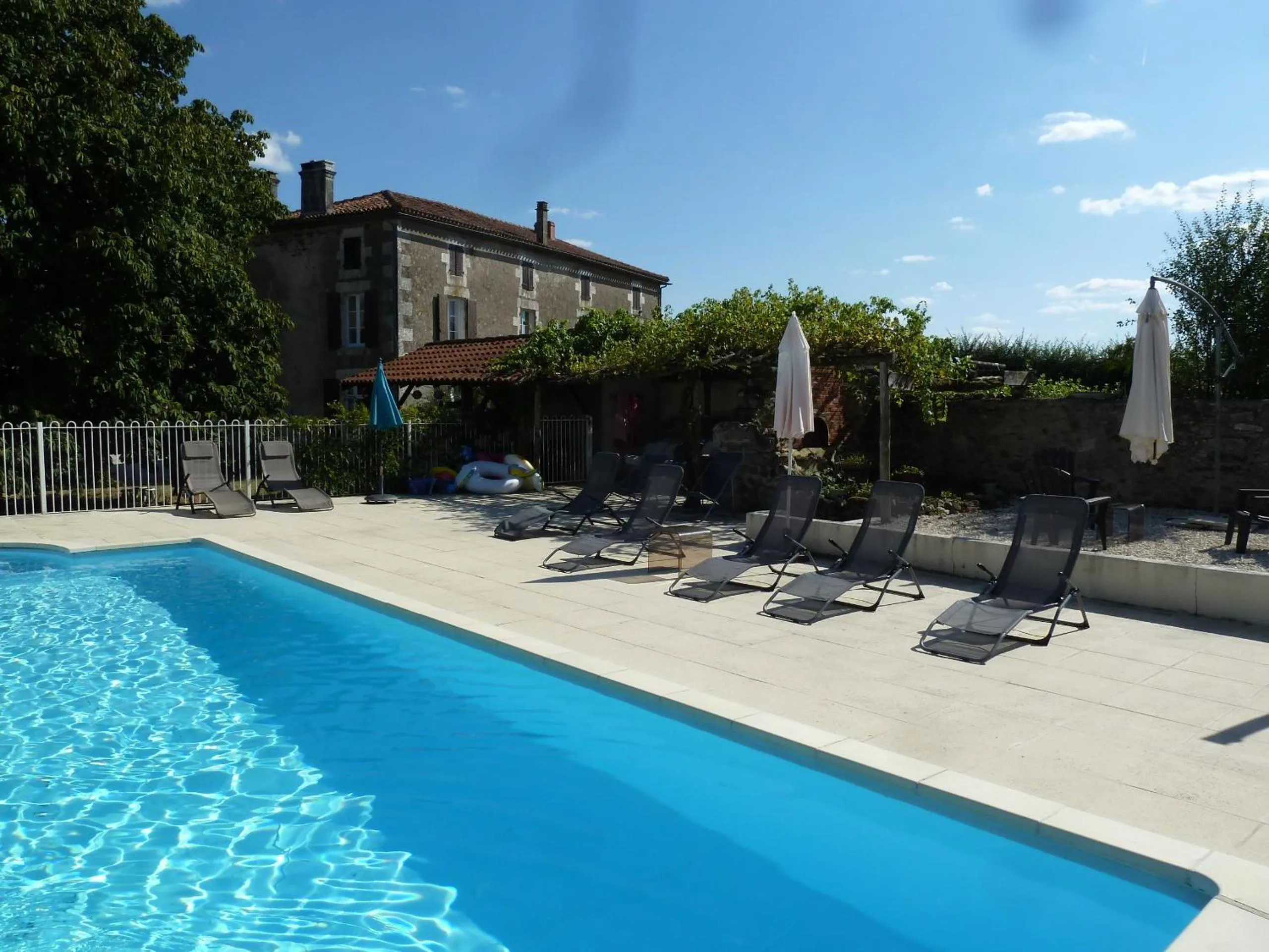 Swimming pool in A L'Ombre Du Marronnier GITES