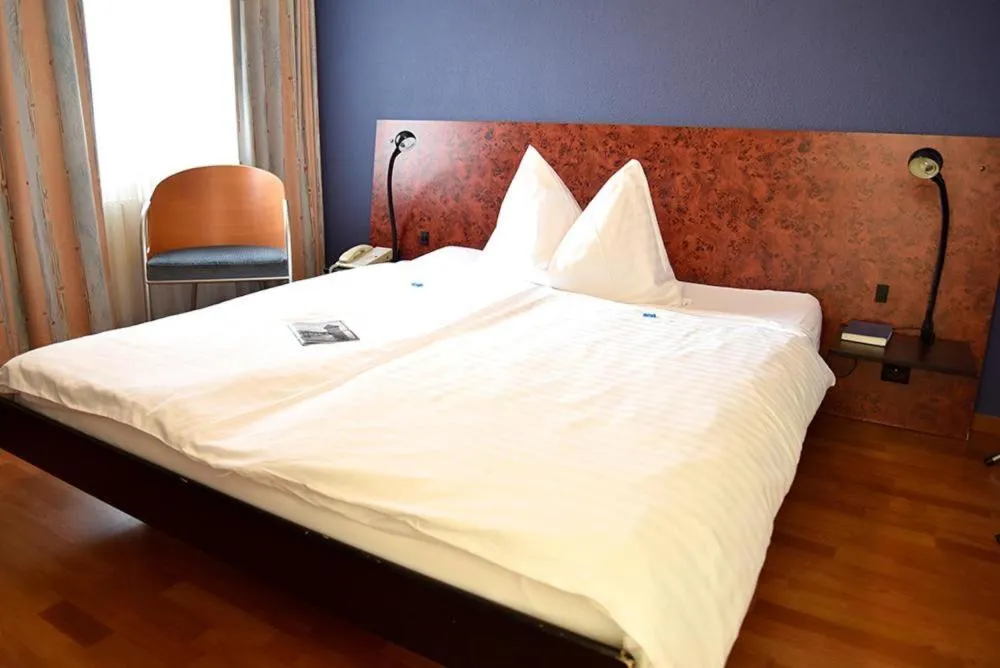 Bed in Hotel Rothaus Luzern & Peruvian Culinary Art
