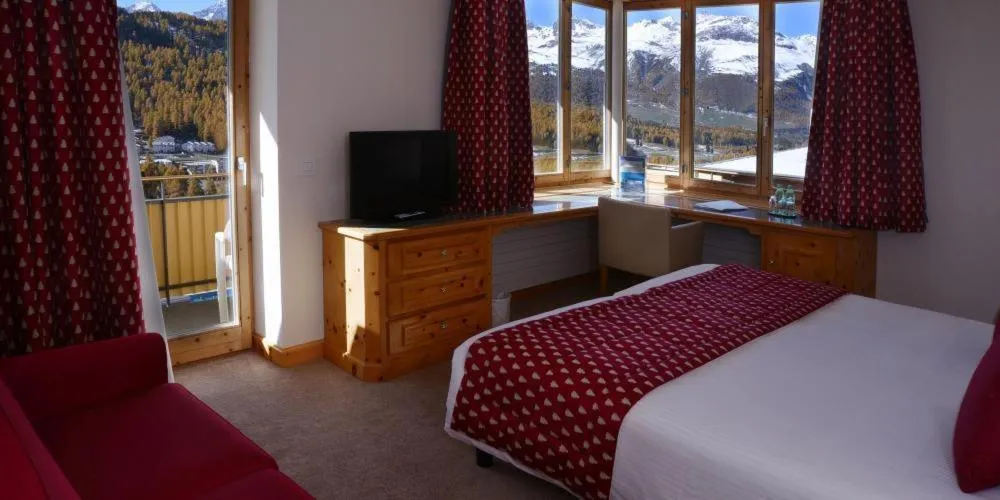 Bed in Hotel Schweizerhof Pontresina