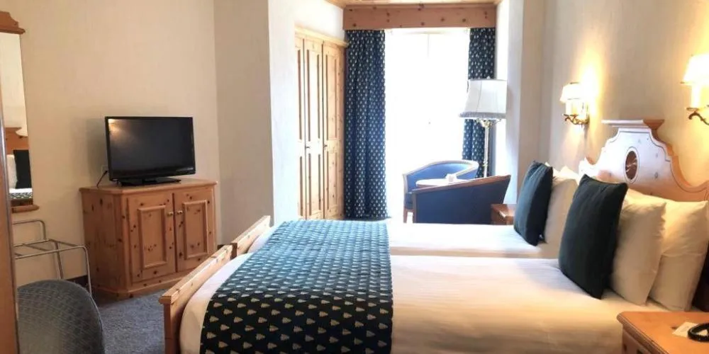 Bed in Hotel Schweizerhof Pontresina