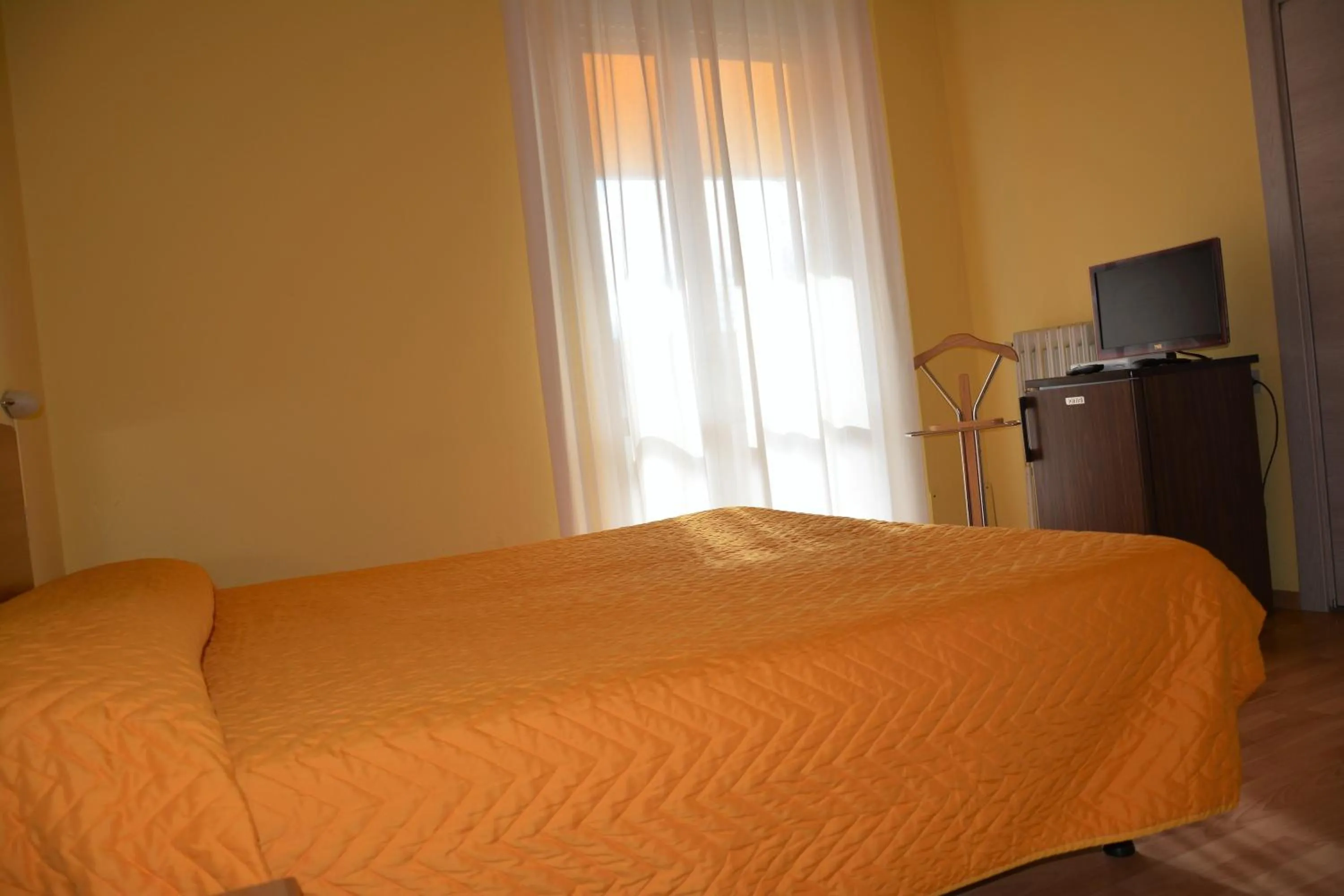 Bed in Piccolo Hotel