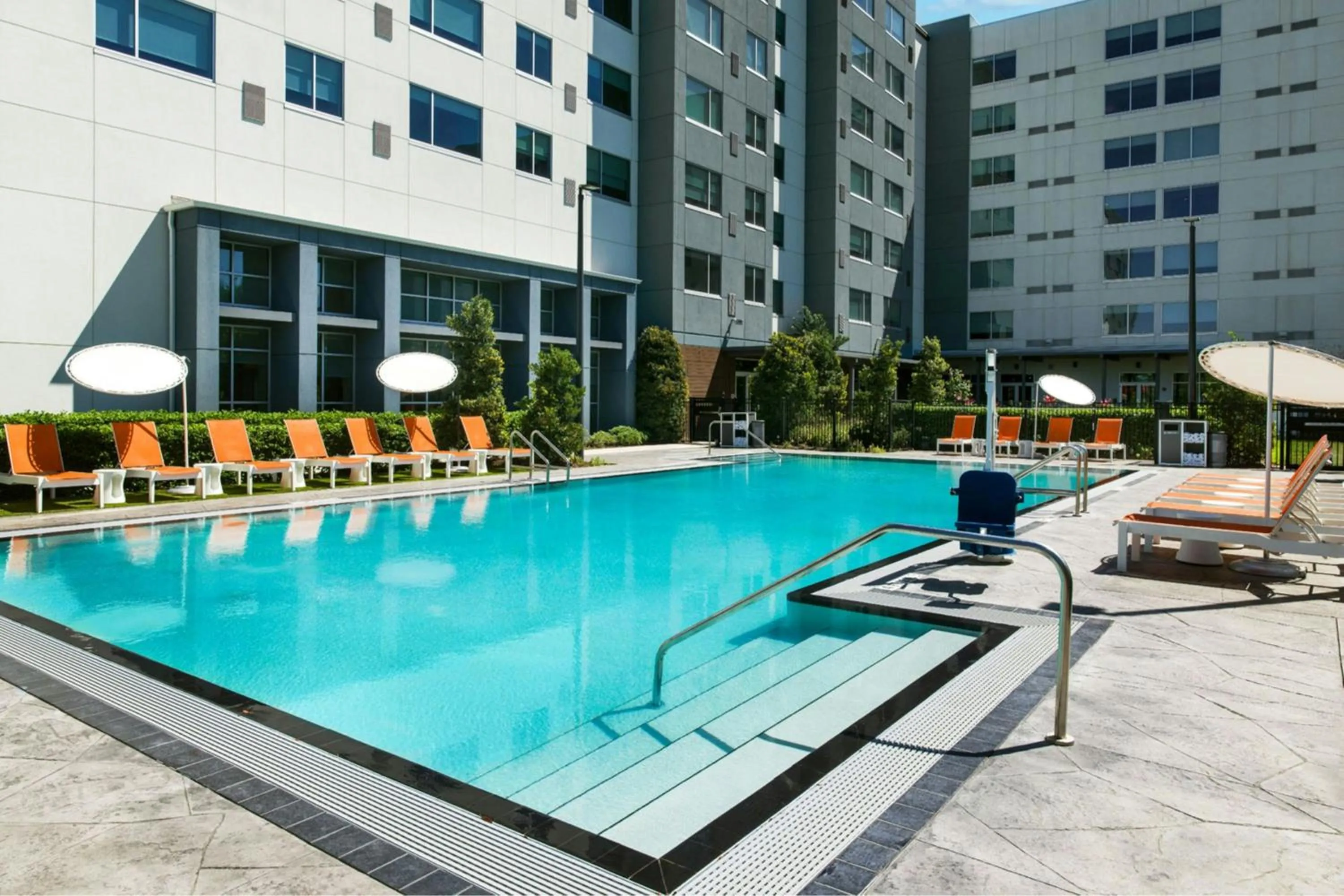 Swimming pool in Aloft Orlando International Drive by Marriott