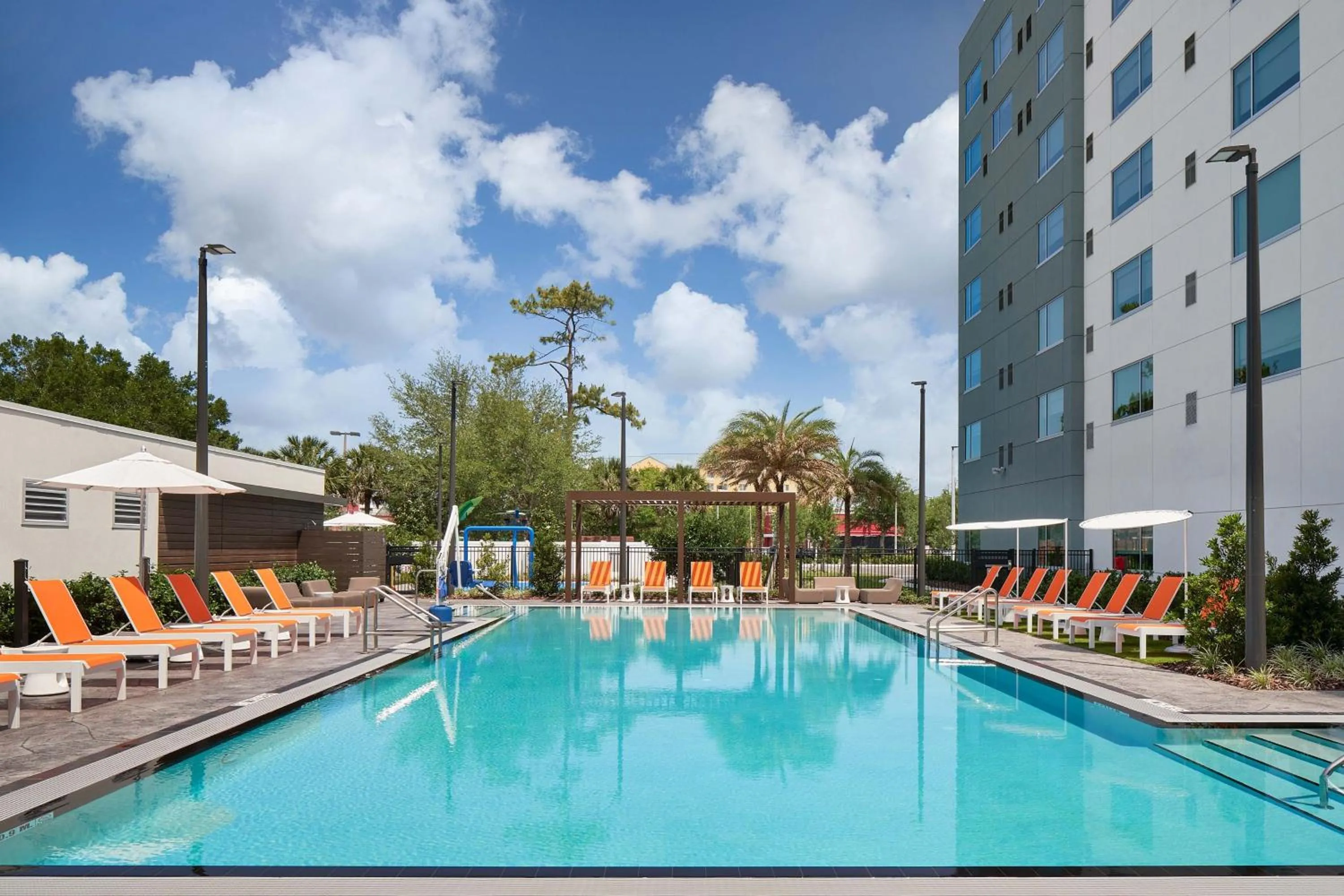 Swimming pool in Aloft Orlando International Drive by Marriott