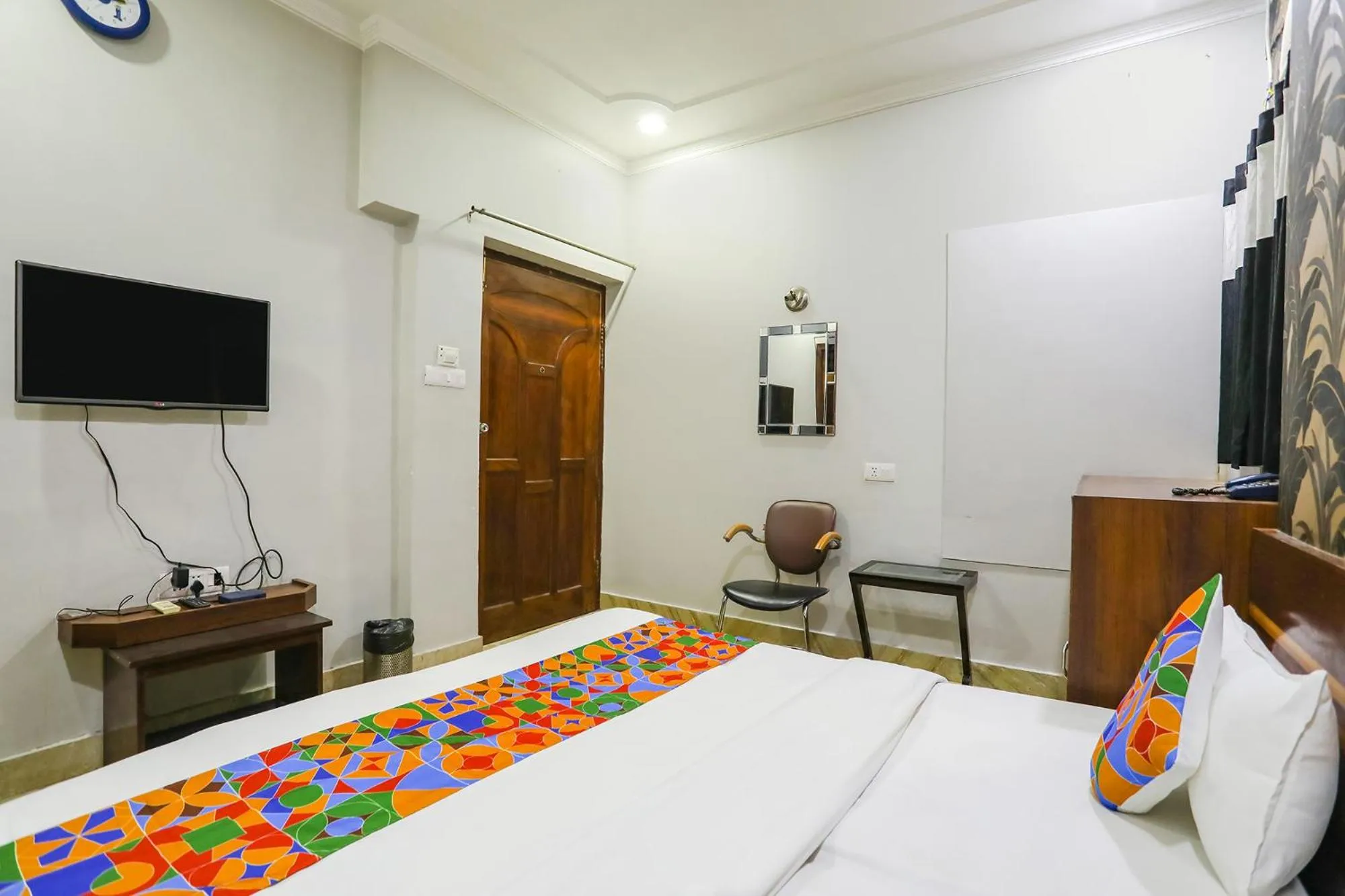 Bed in FabHotel Raka Inn