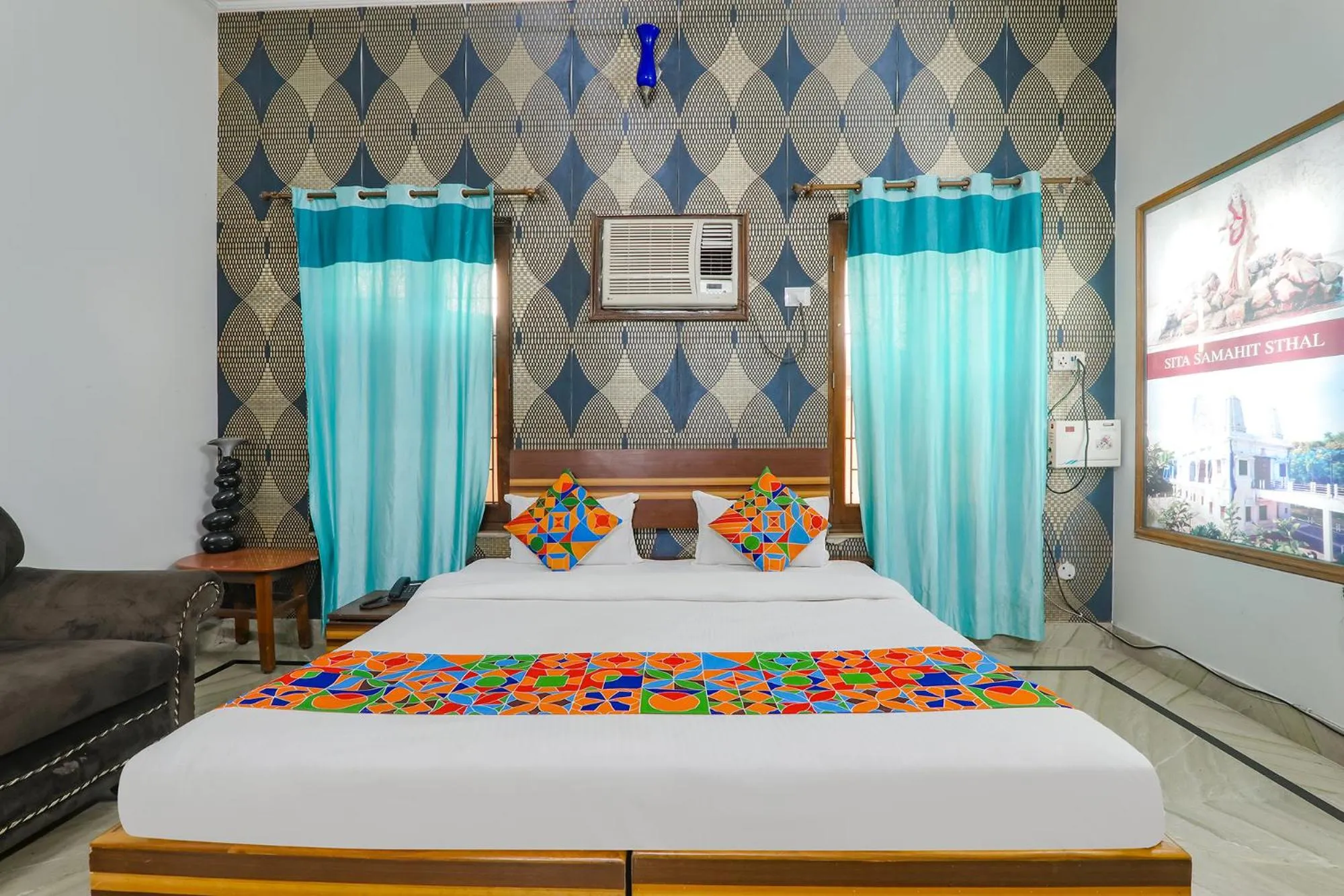 Bed in FabHotel Raka Inn