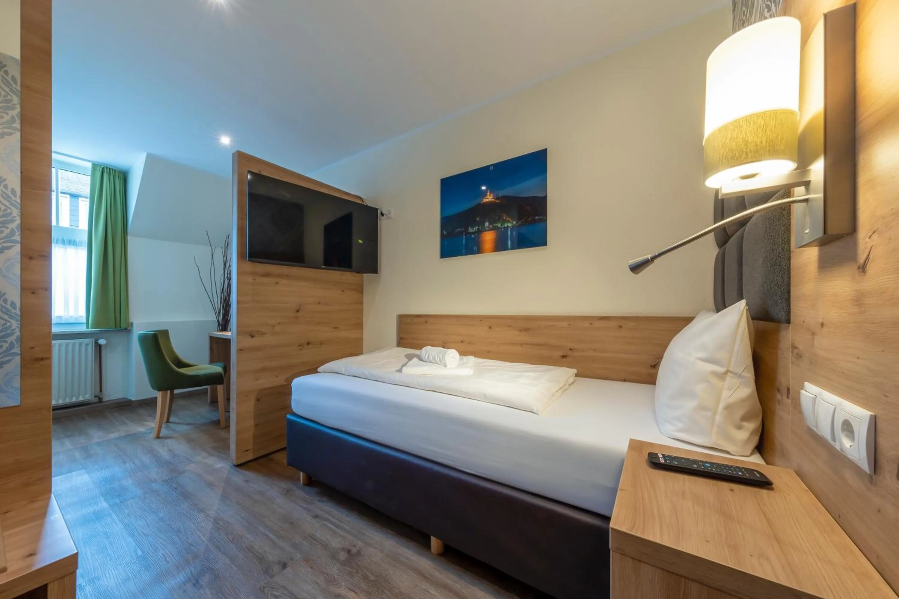 Bed in AKZENT Hotel Restaurant Roter Ochse Rhens bei Koblenz